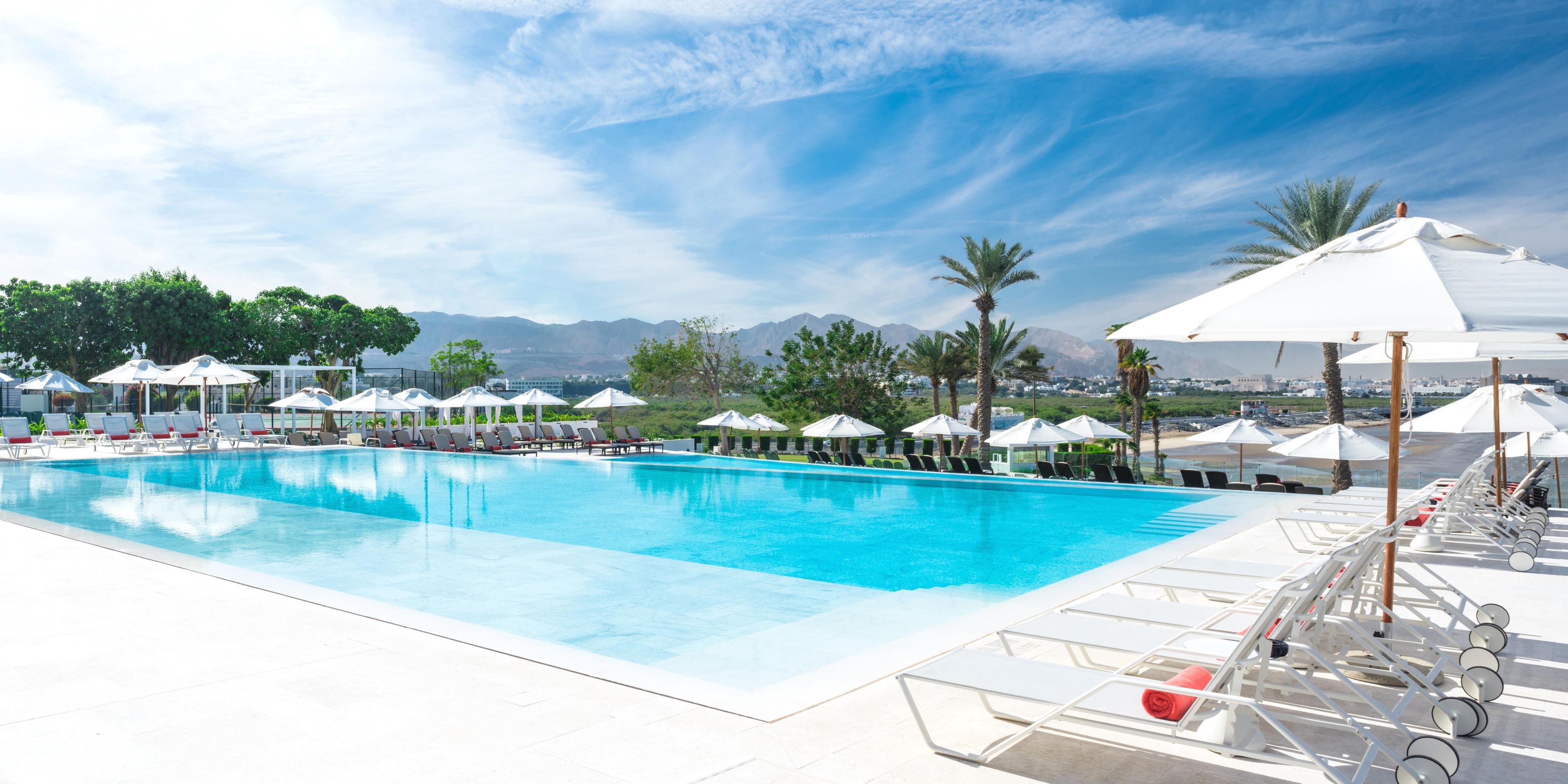 Soak in the beauty of endless blue waters and serene luxury by the poolside