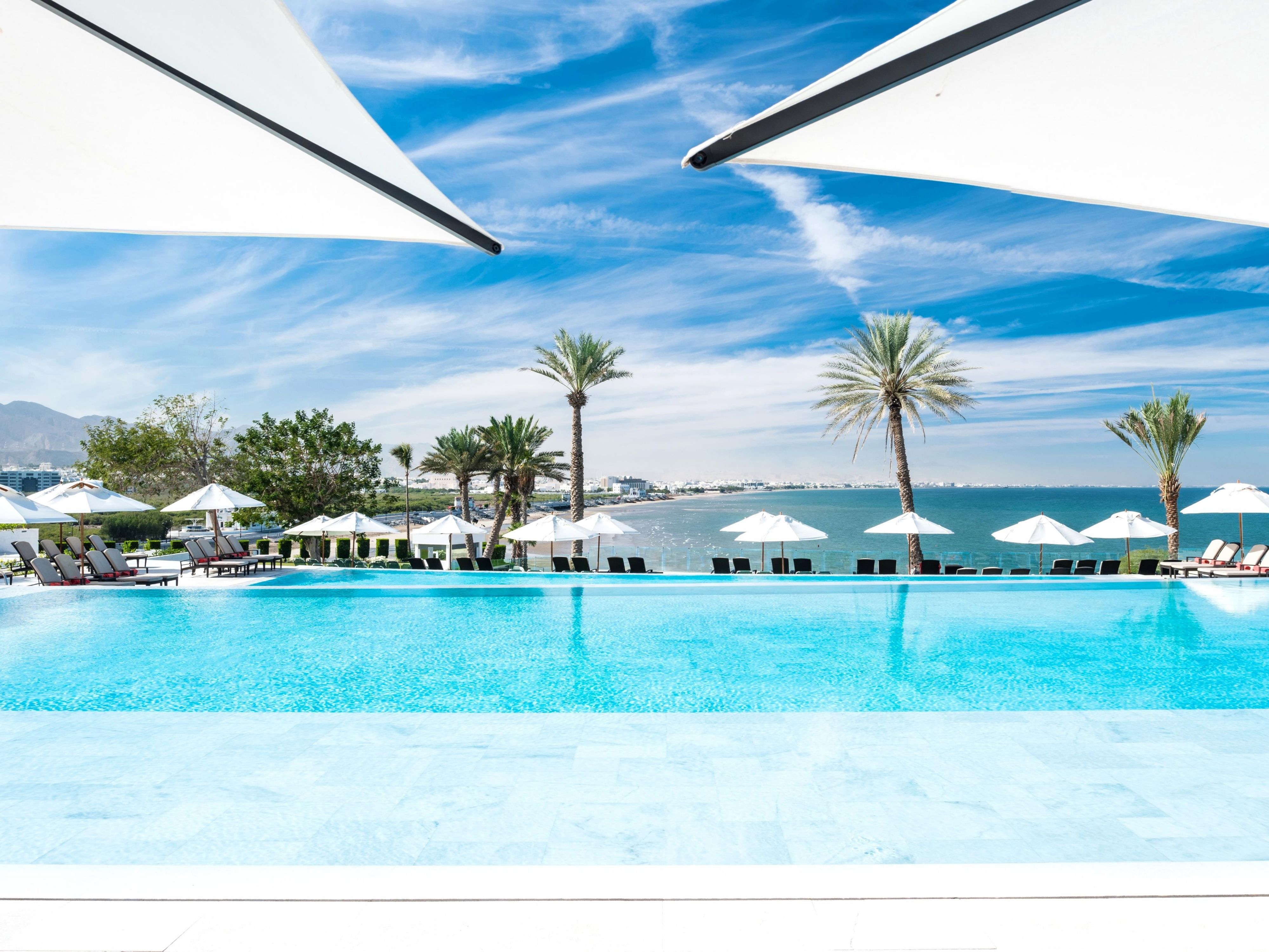 Splash into a pool of breathtaking views! Our double-deck infinity pool, kept just right for you, gives you the feeling of swimming into the endless expanse of the Gulf of Oman.