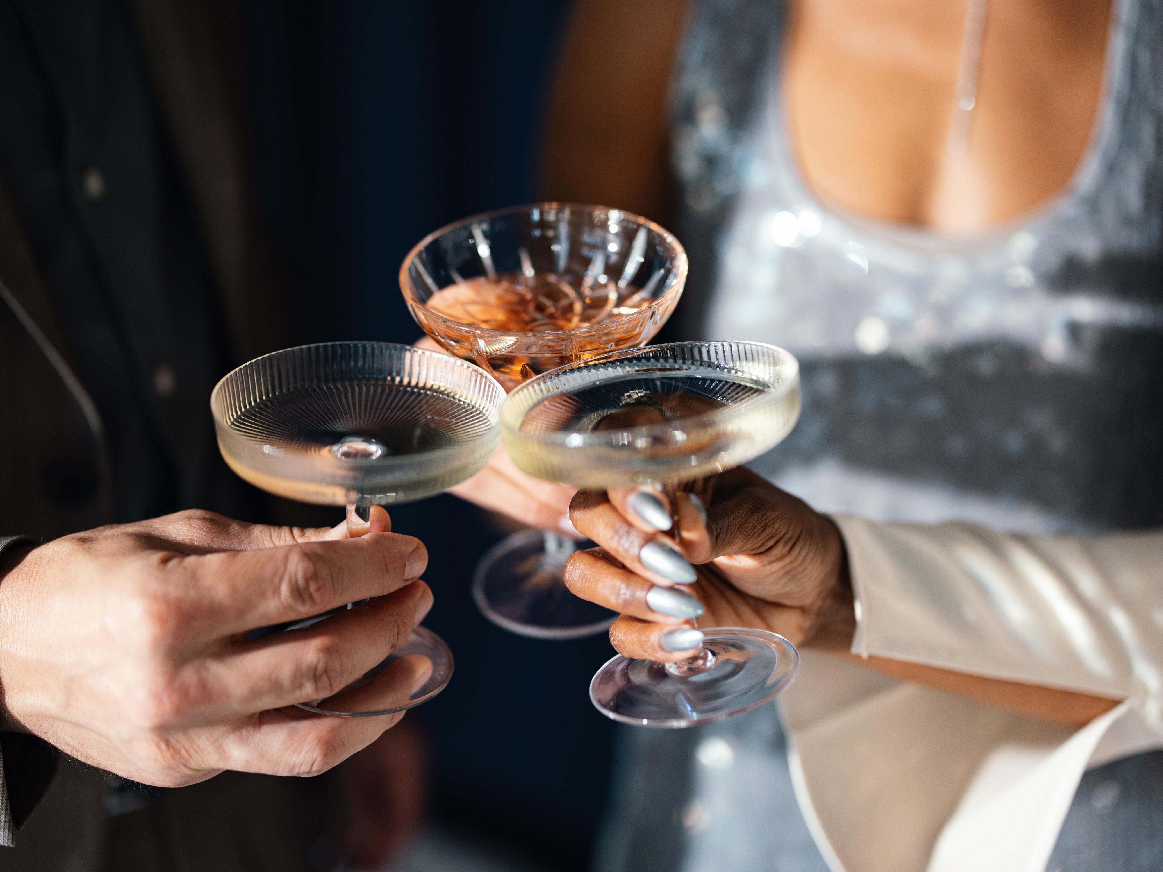 guests cheersing with cocktails