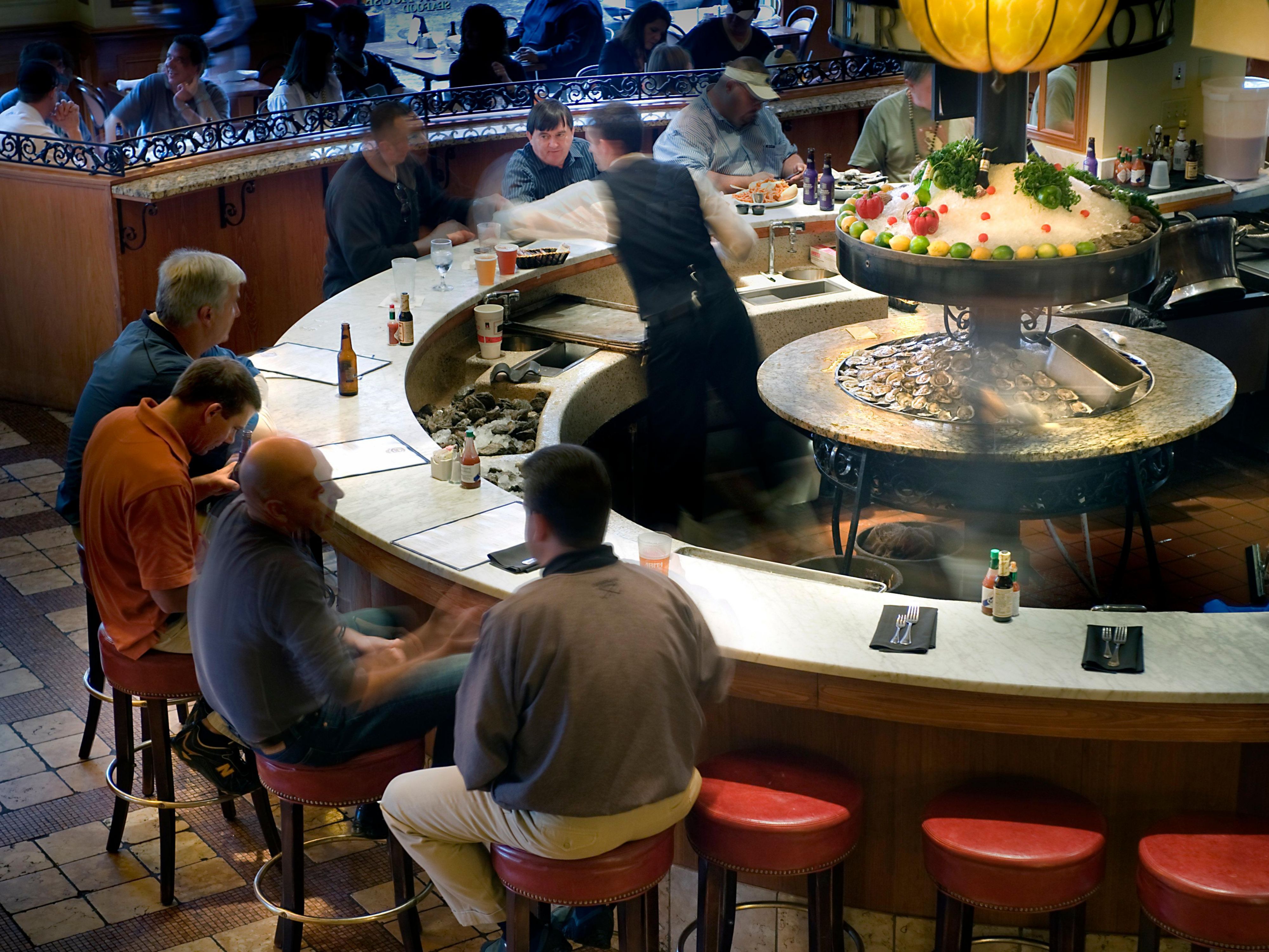 Group of men sitting at bar