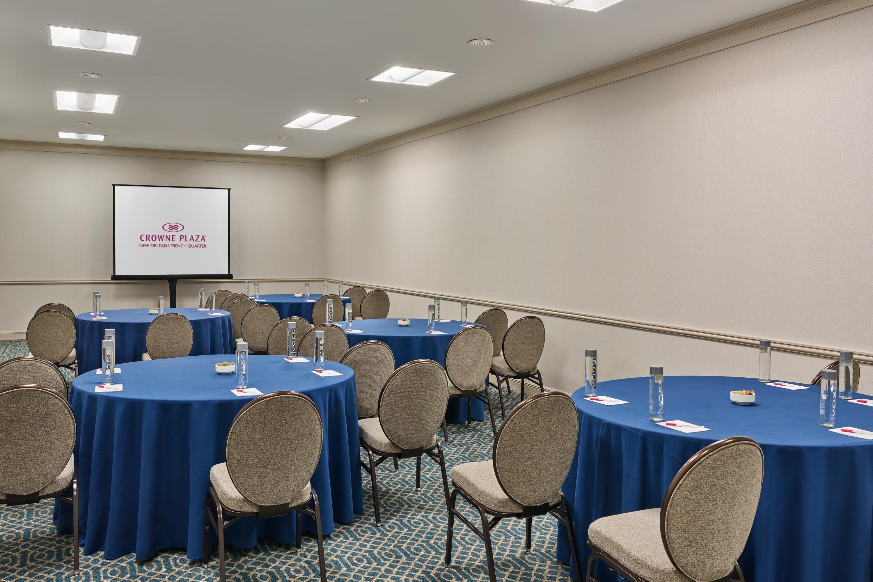 Bourbon meeting space with circular tables and plenty of seating for up to 65 guests