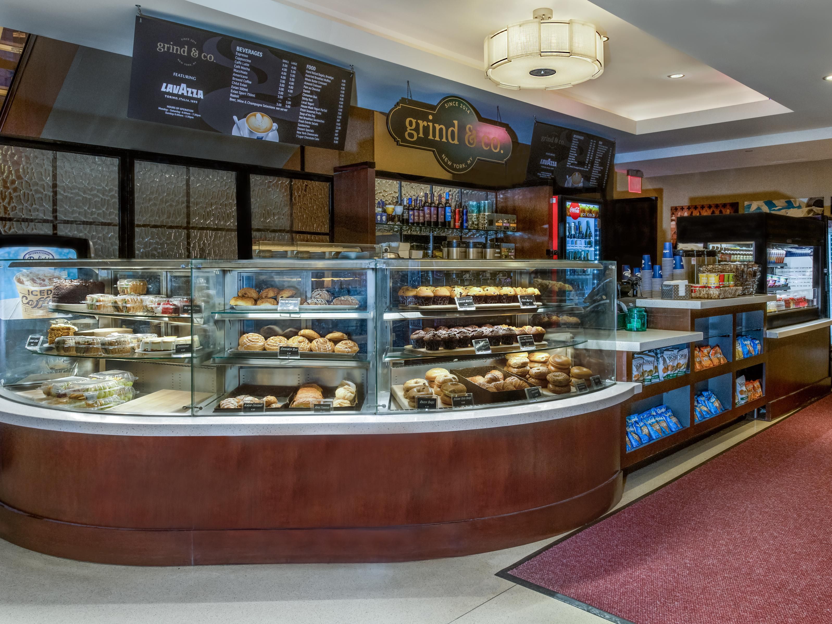 Begin your day at Grind n Co Coffee! Discover a world of beverages, featuring local Stone Street Coffee. Explore grab-and-go bites. Elevate your experience with wine for a Central Park picnic. Your day, elevated!