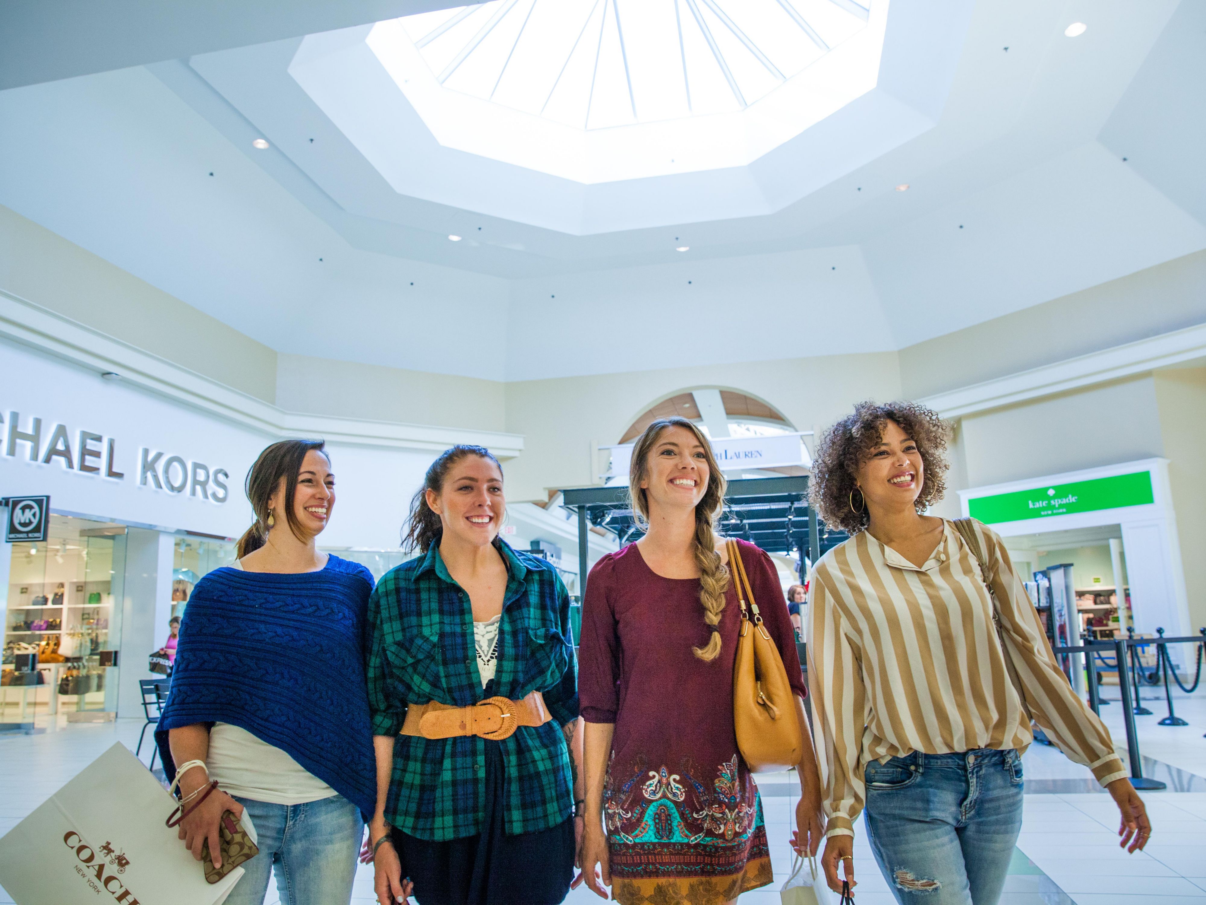 Friends walking through the mall