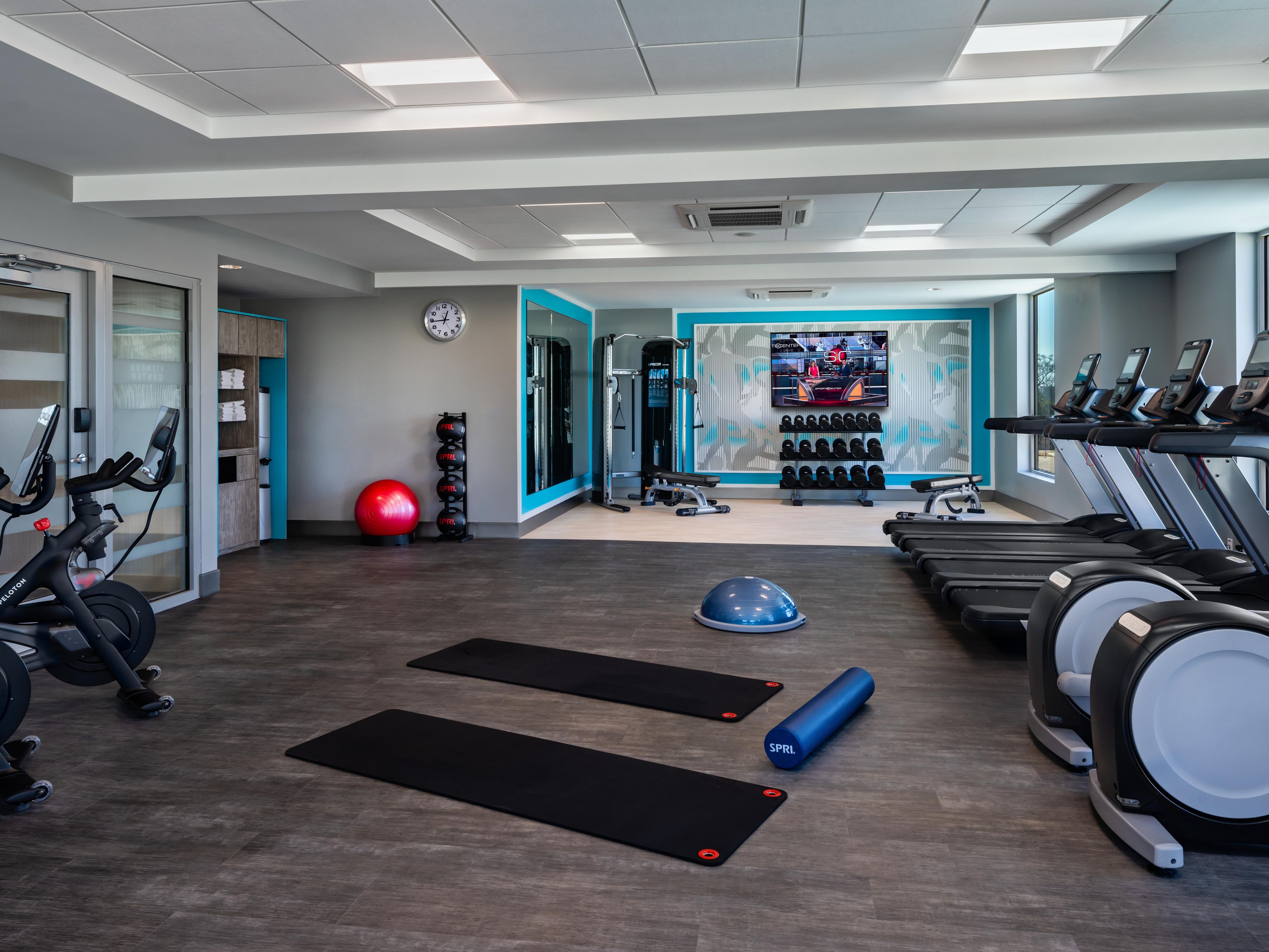 Fitness center with cardio equipment.