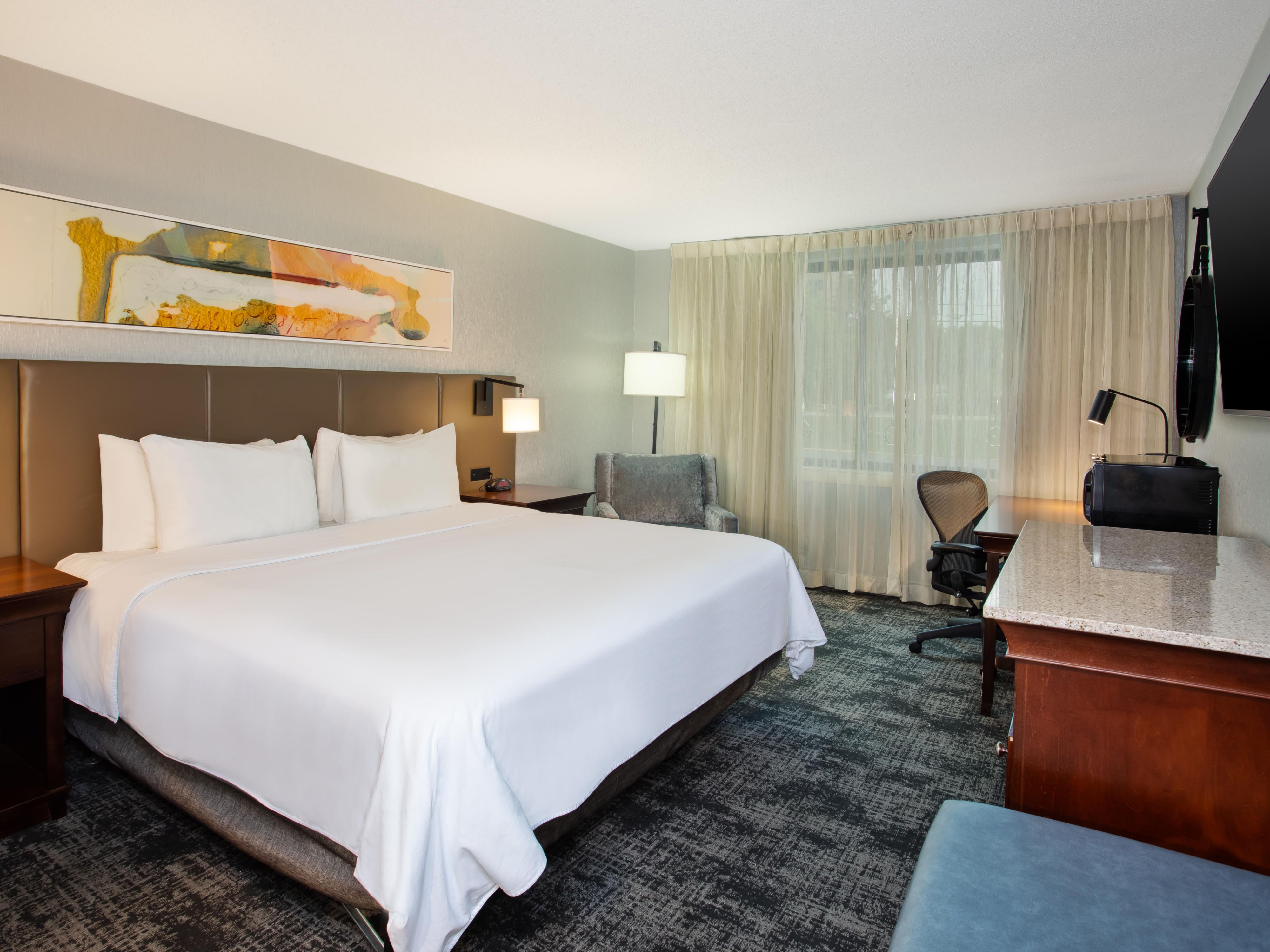 Guestroom with king bed and plenty of storage