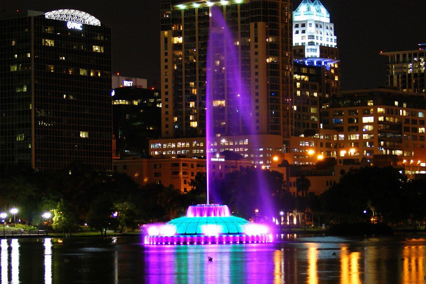 Colorful fountain display in front of buildings in downtown Orlando