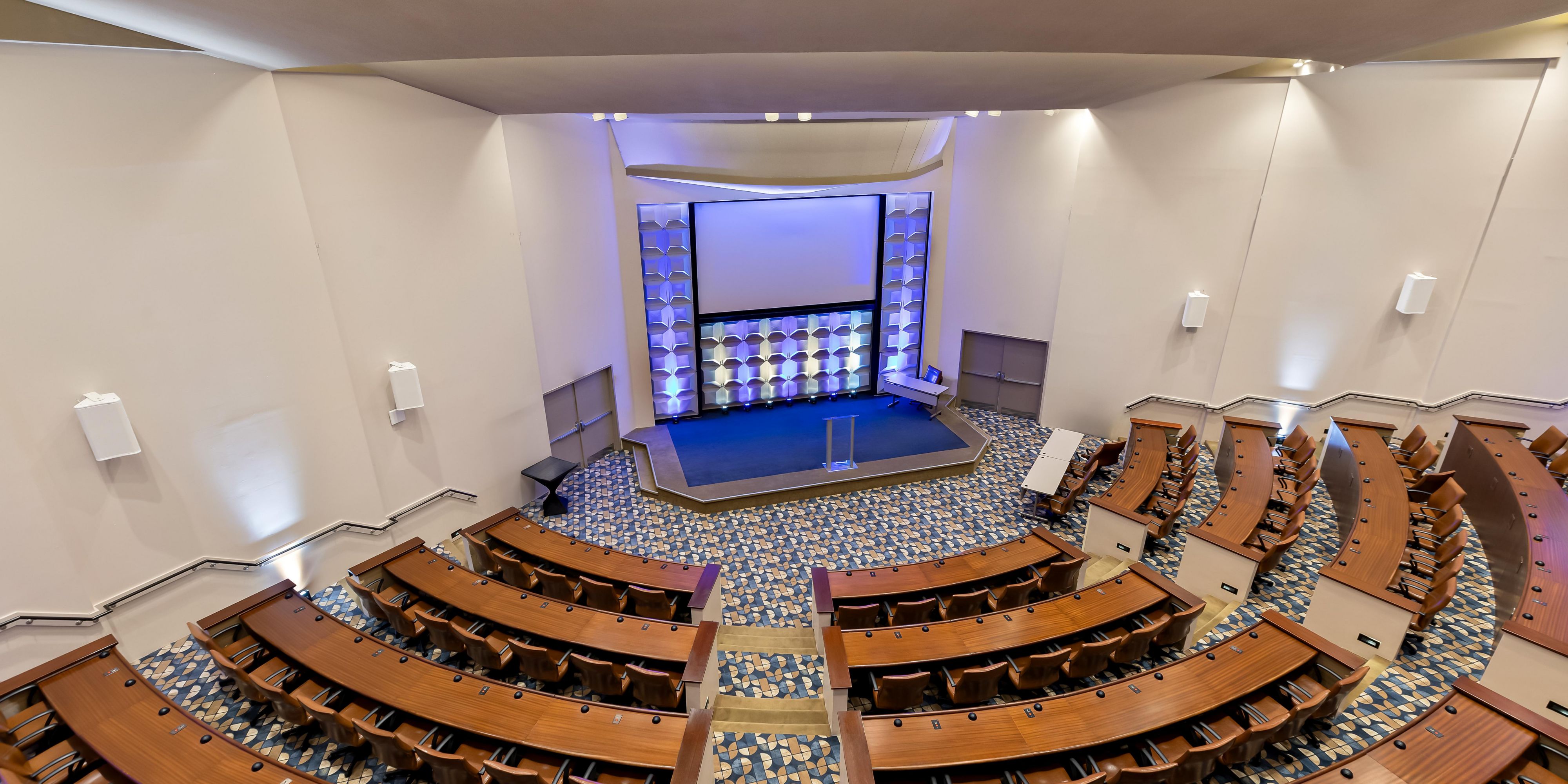 Top view of the amphiteatre with a stage, seating and projector screen