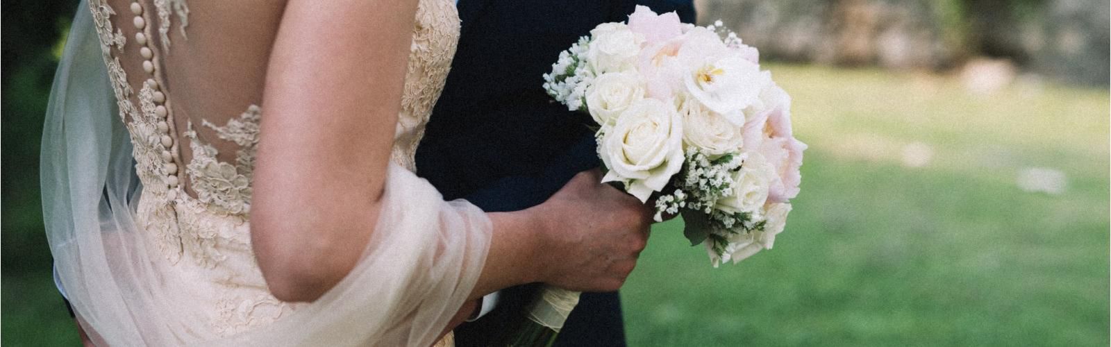 Couple getting married holding bouquet