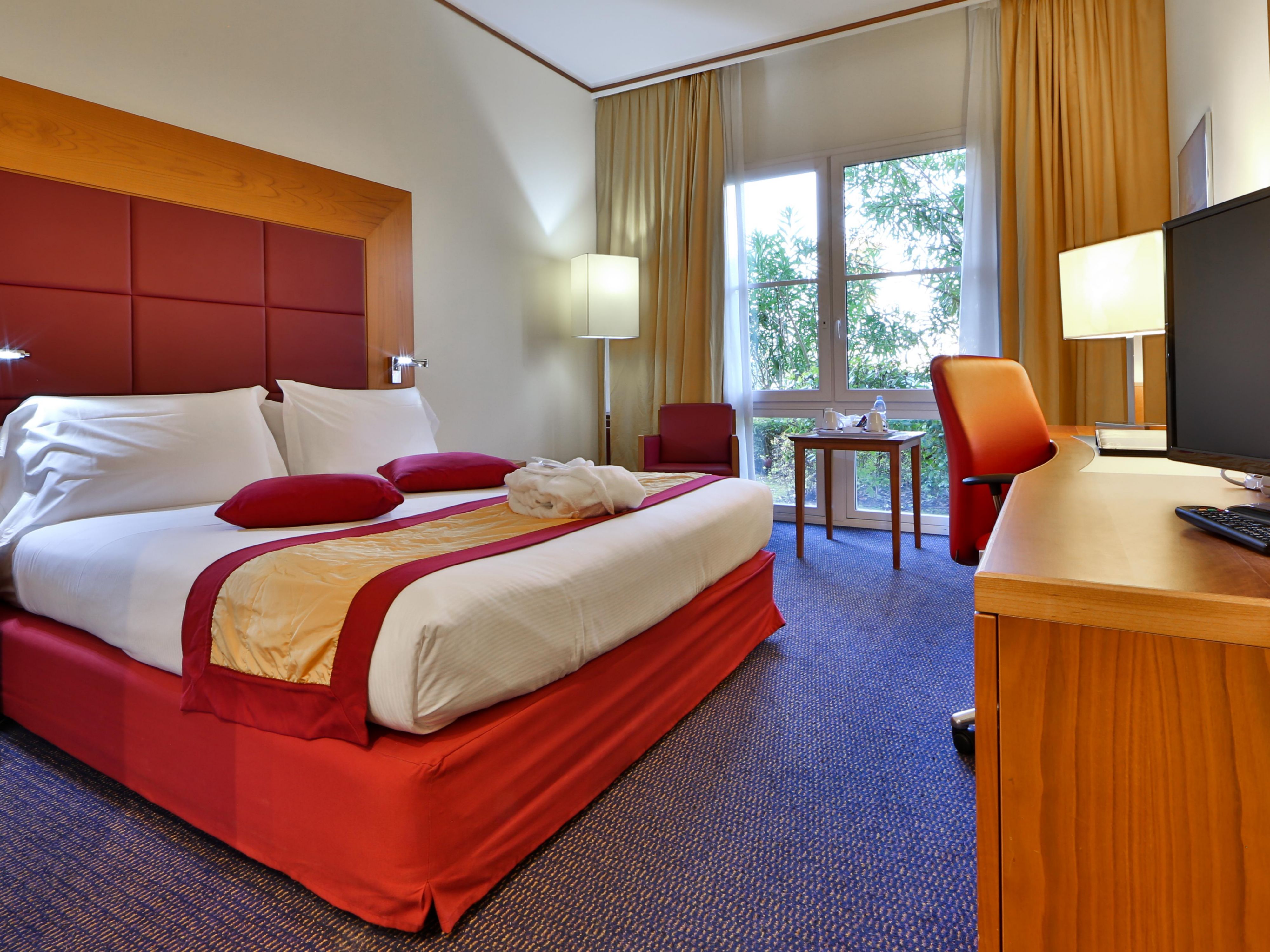 Relax in our superior rooms with plush king bed