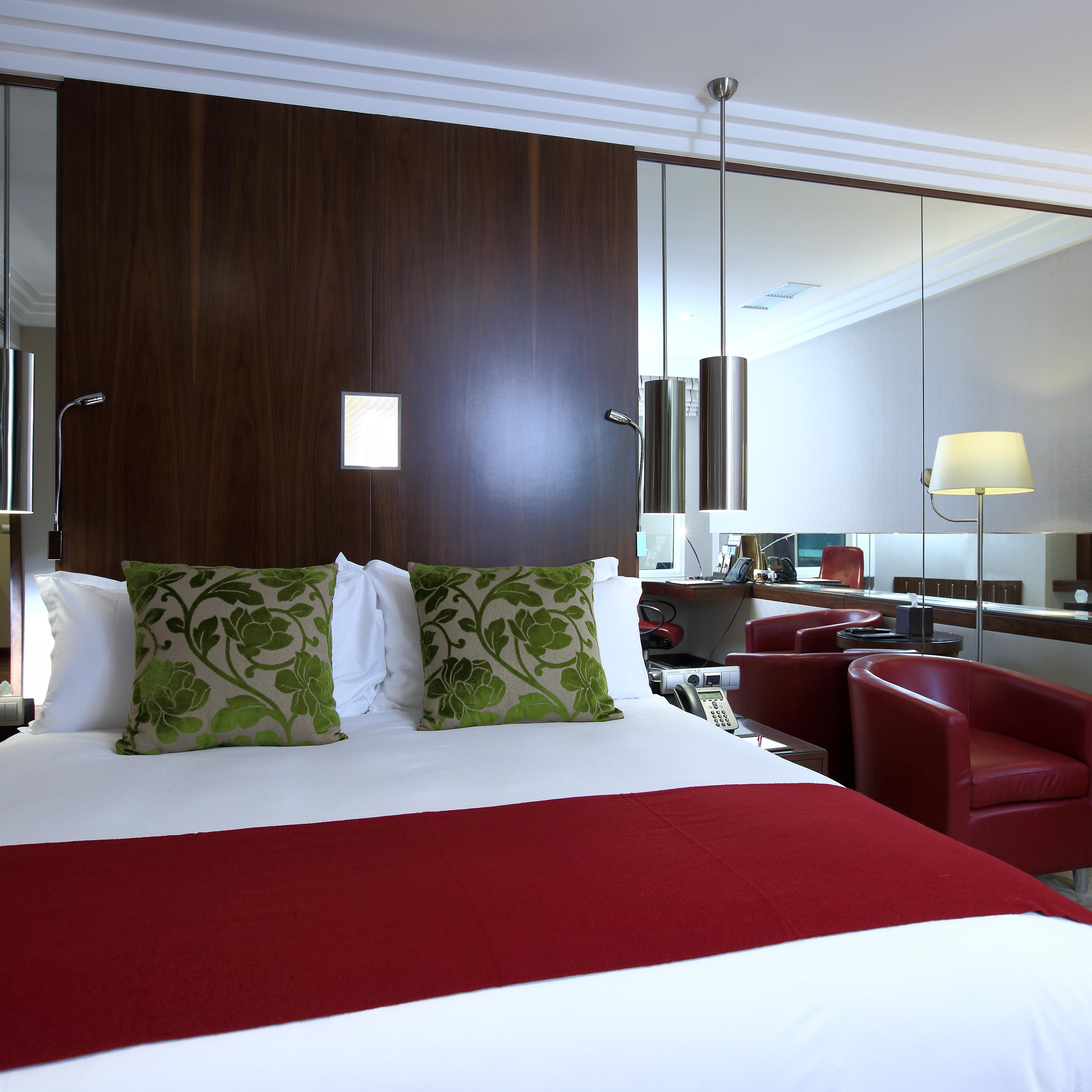King sized bed in the spacious and ergonomic Deluxe Room