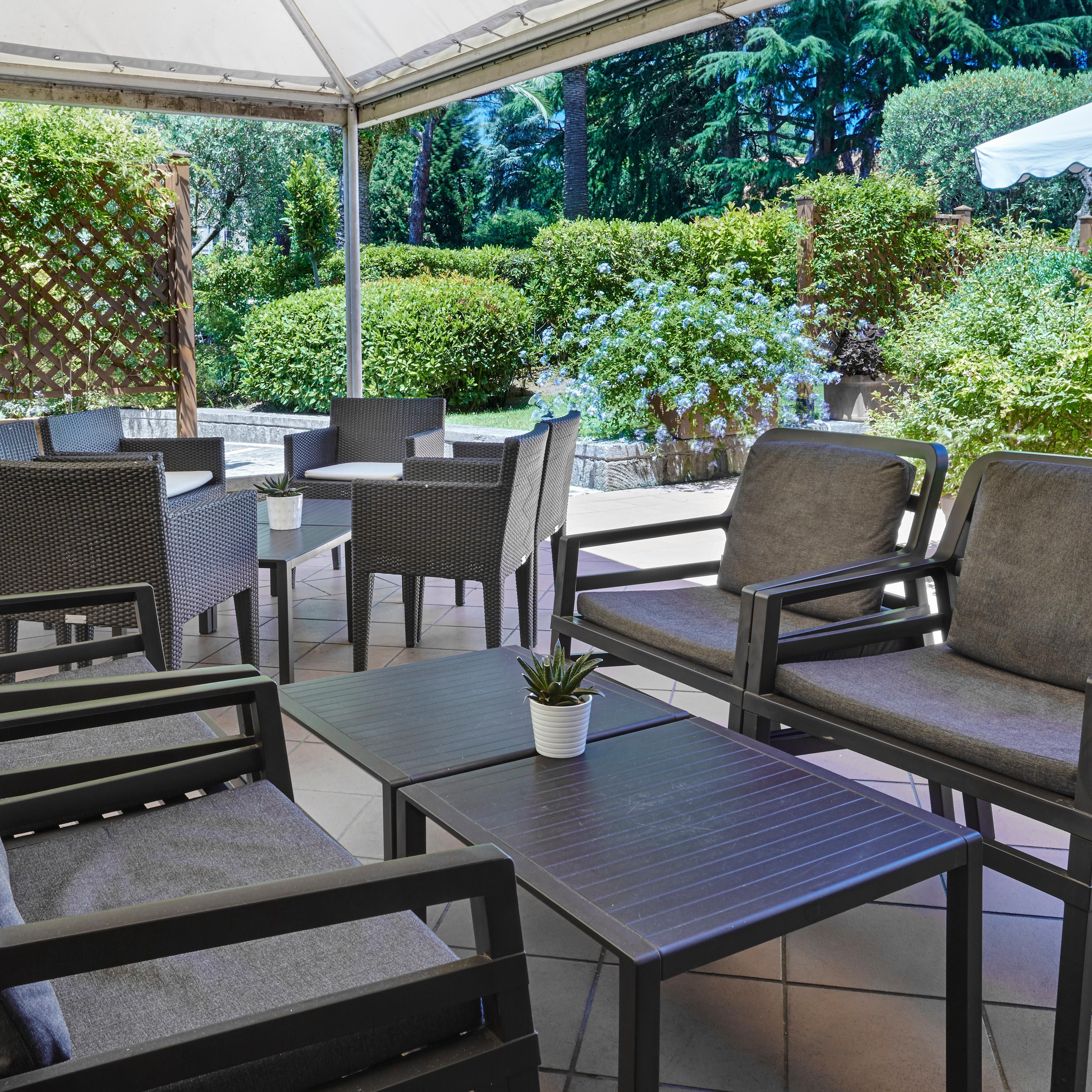 Relax yourself in the external courtyard of our bar Lumière