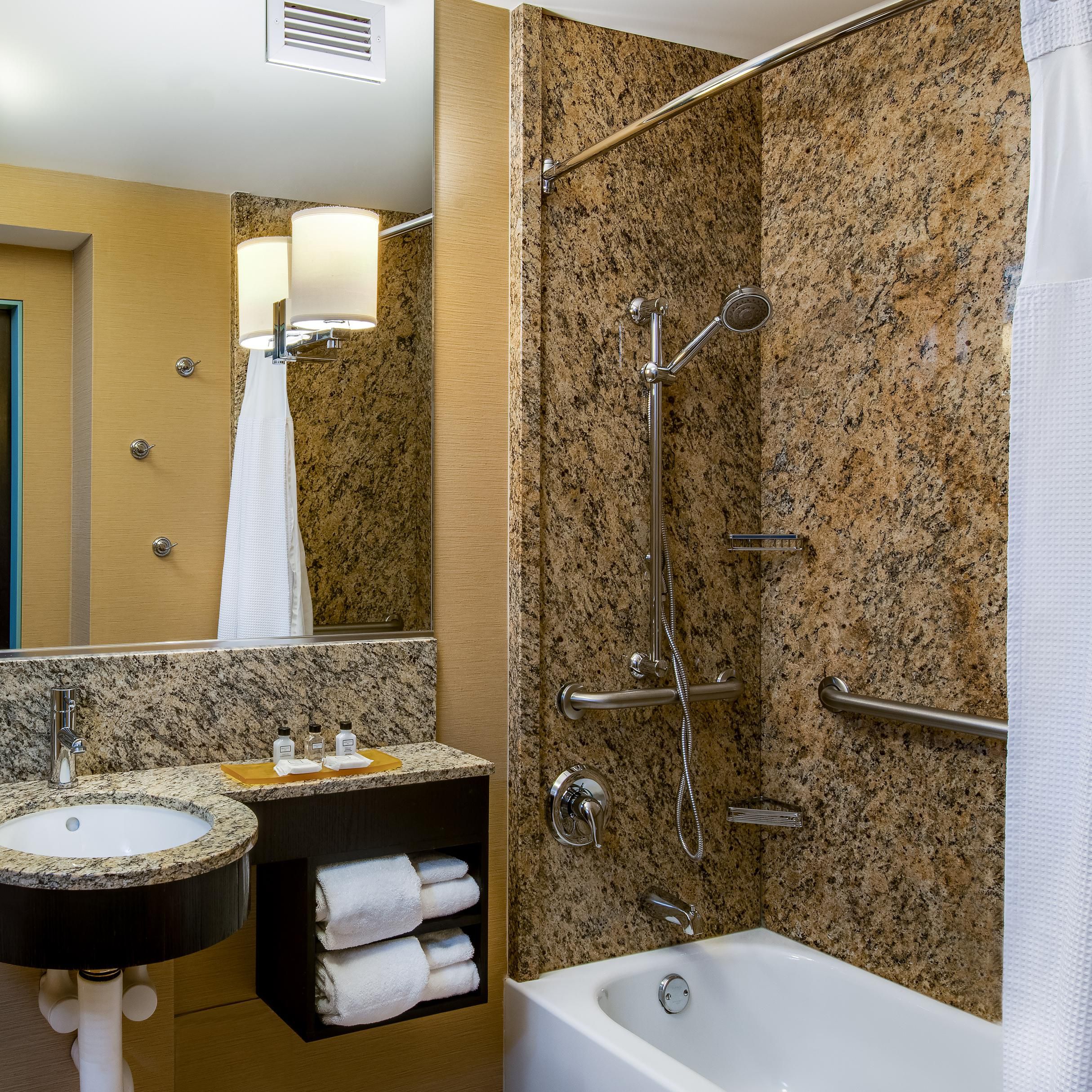 Relax in our Guest Bathroom with modern marble finish.