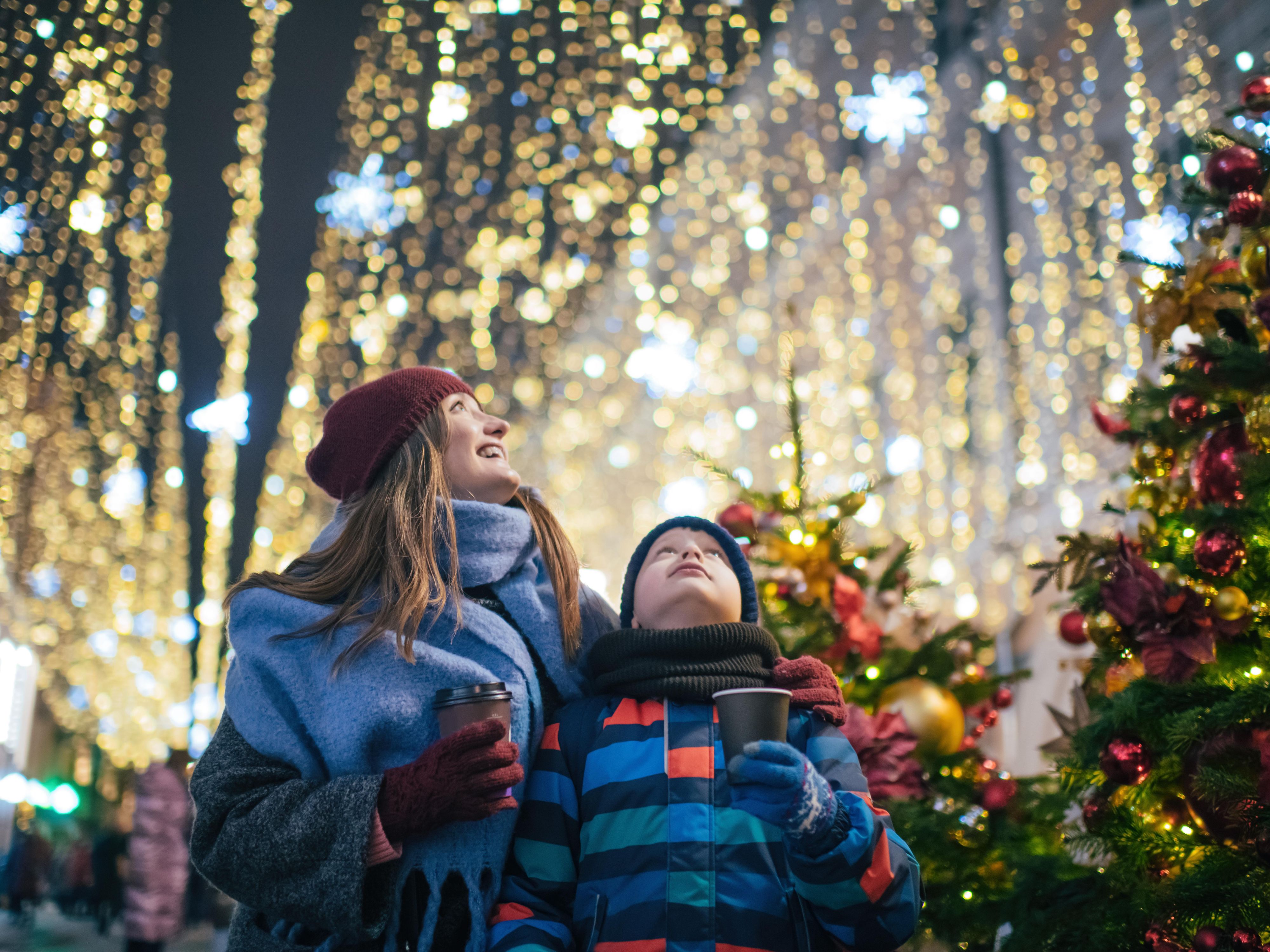 Mother and son looking in awe at lights