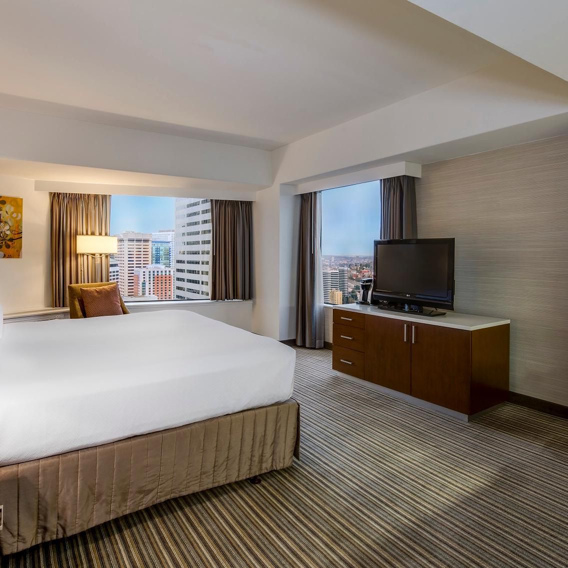 Our spacious guest rooms offer expansive views of Seattle.