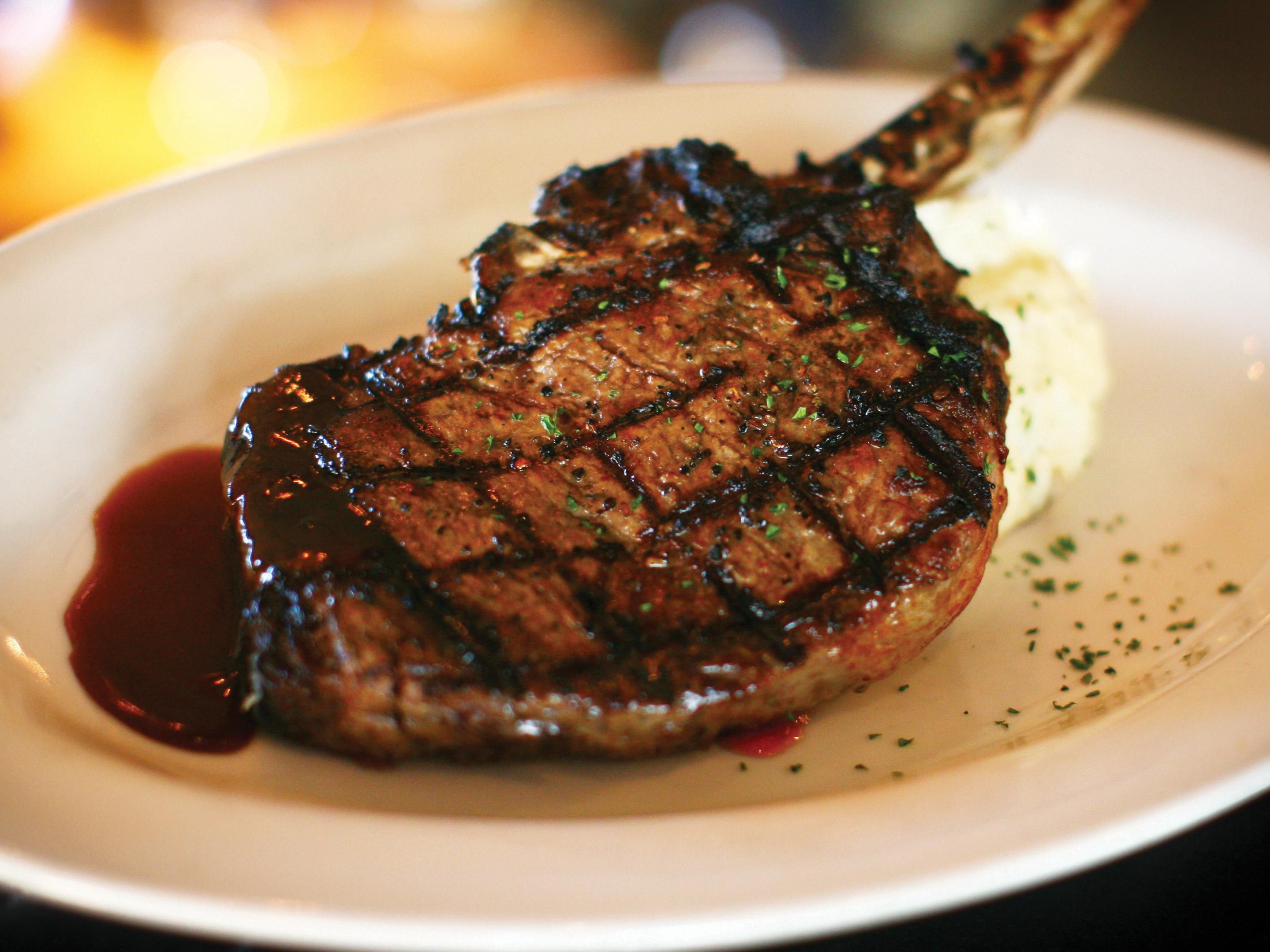 20 oz bone in ribeye on a plate