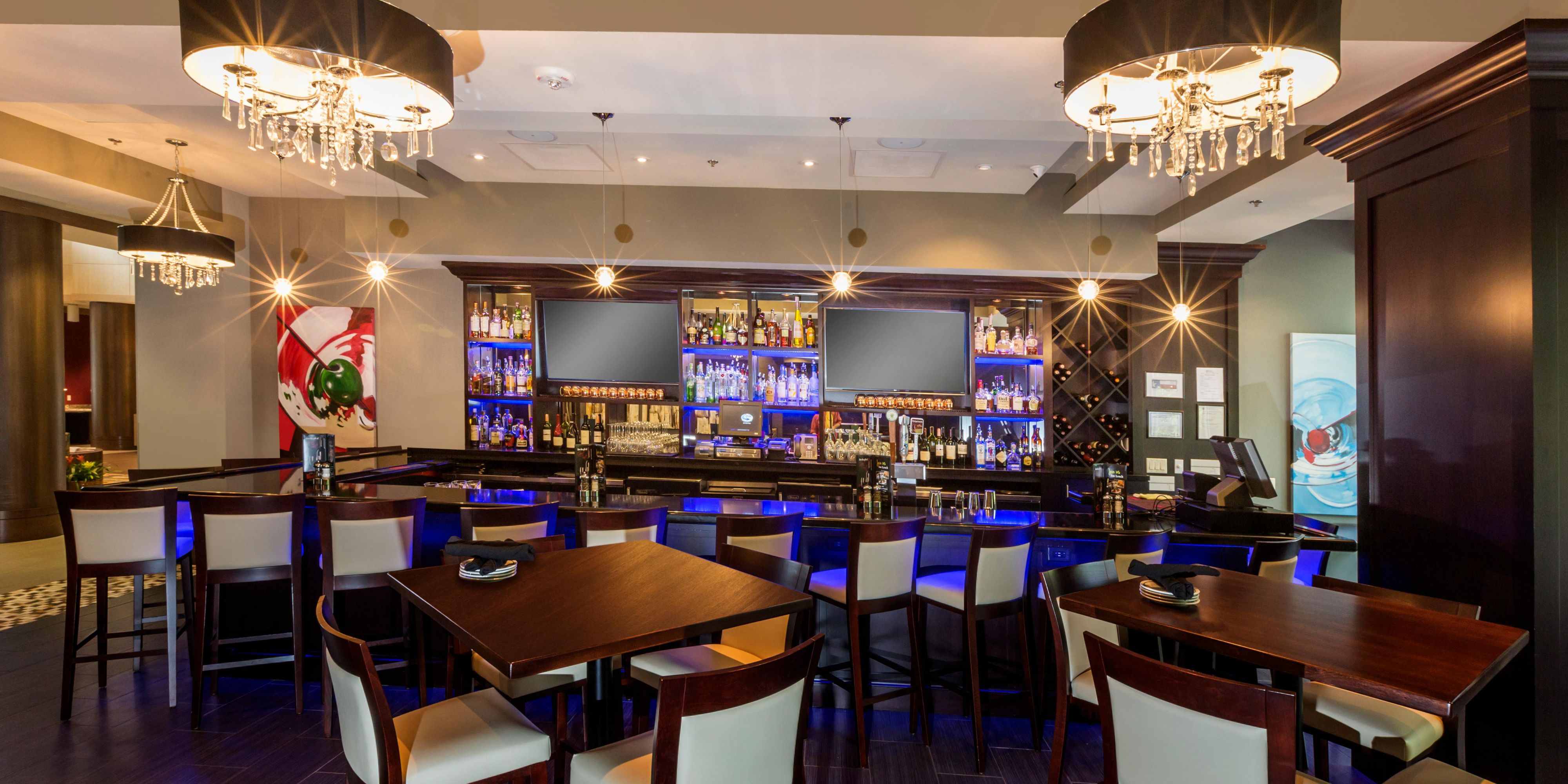 Blue Bar at Crowne Plaza Shenandoah with chic lighting and drinks.