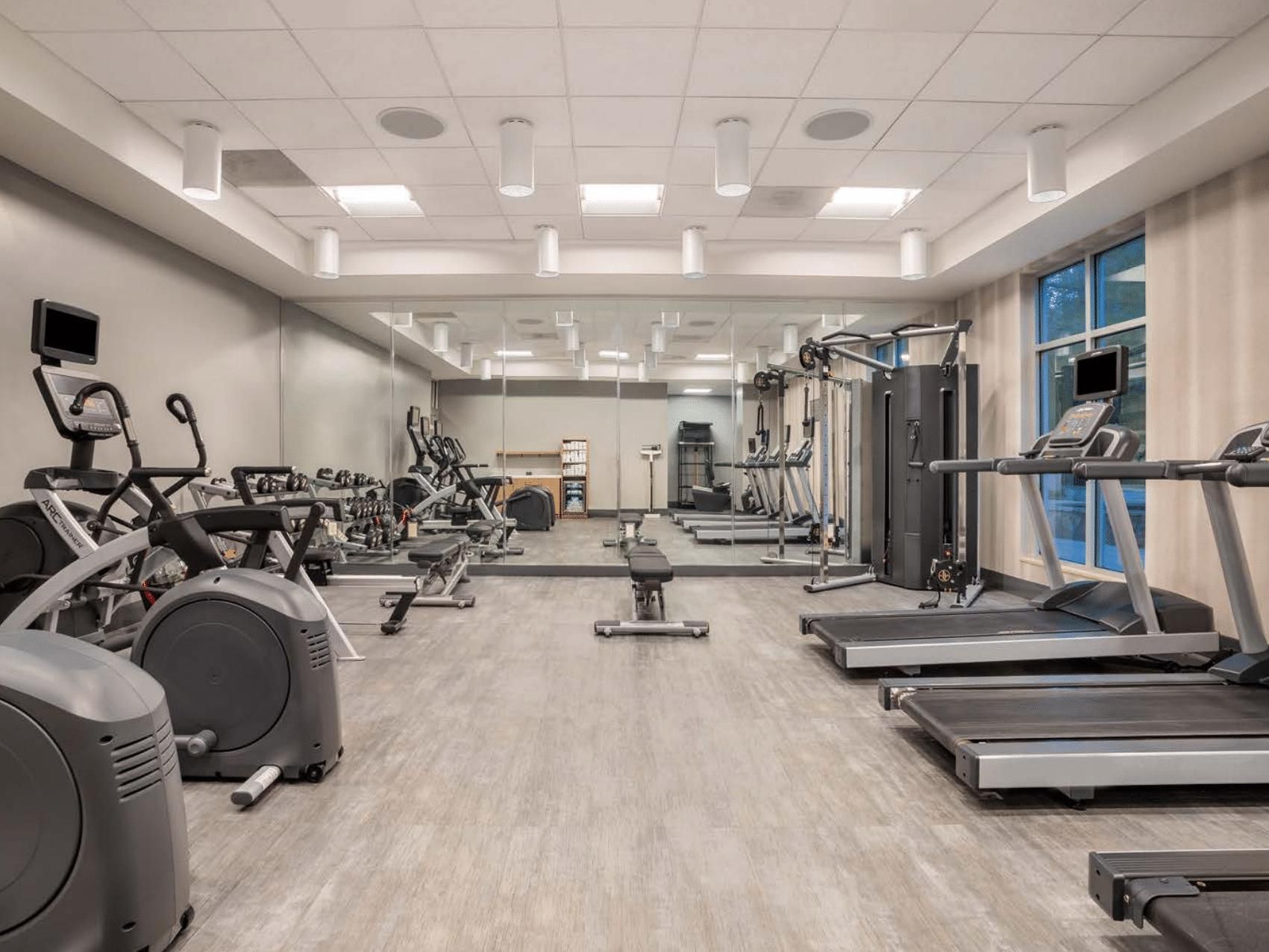 Well-equipped exercise room at Crowne Plaza Shenandoah, Texas.