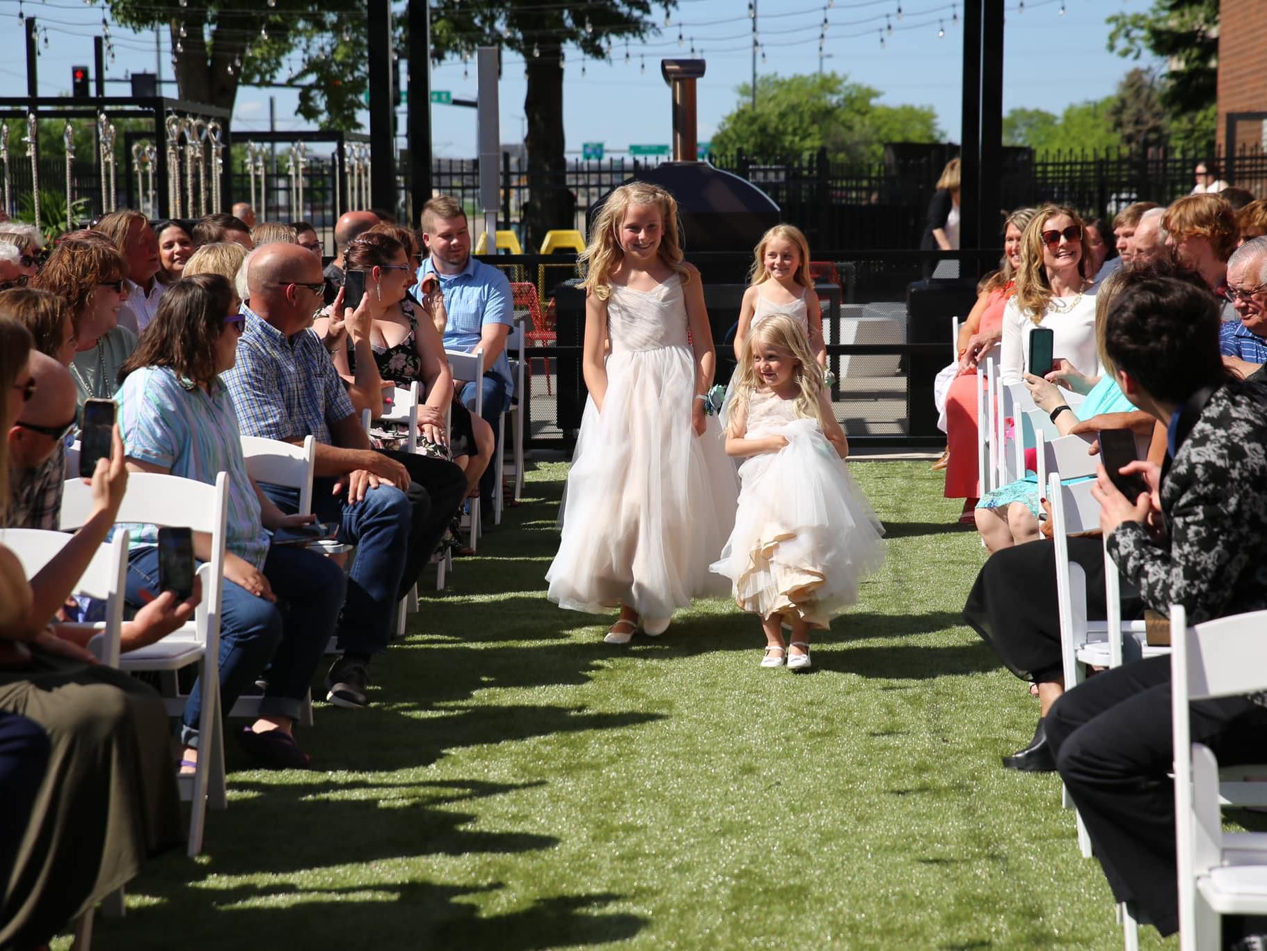 Flower girls walking down the aisle