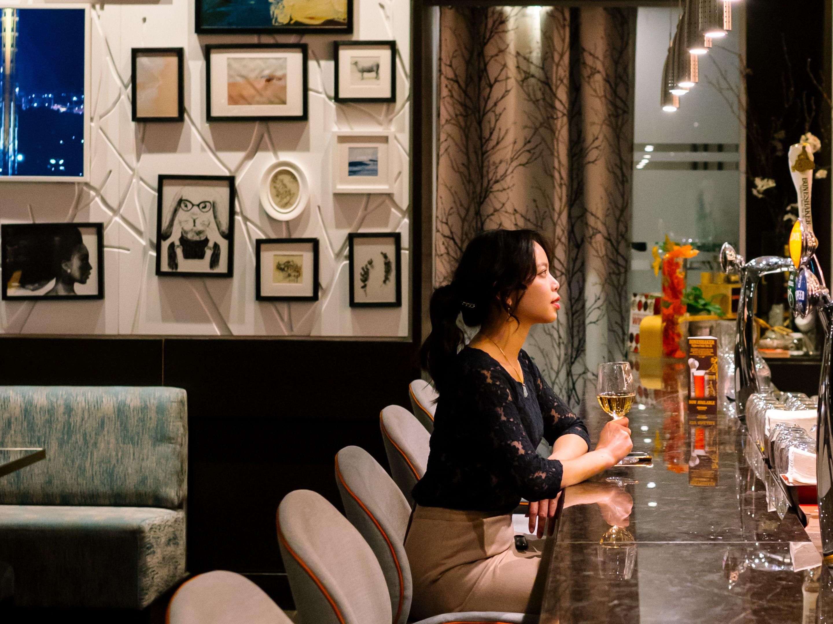 Guest sitting at hotel bar