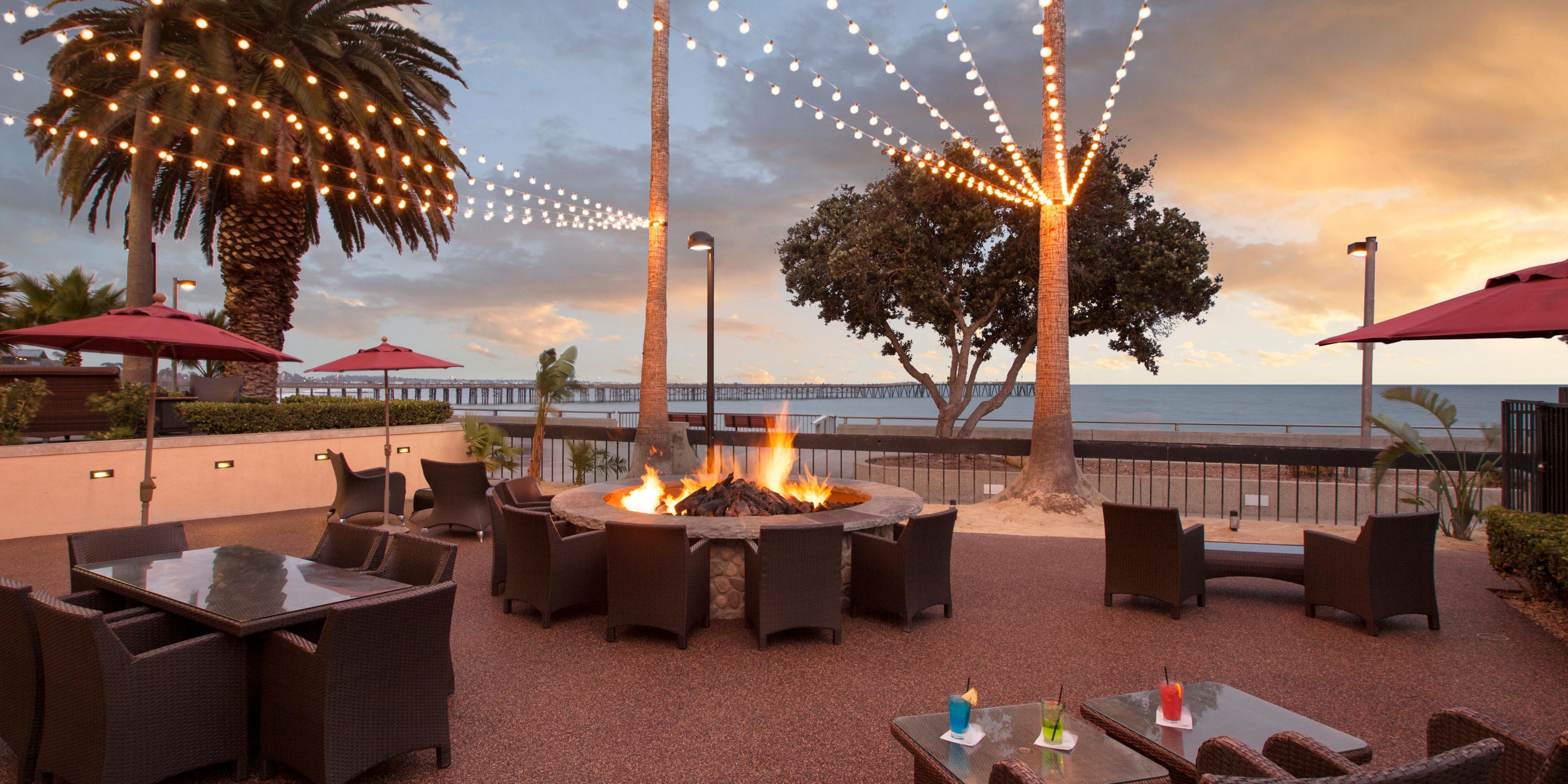 Soak in ocean views from our 2,500 sq. ft. Lanai Patio, perfect for cocktail parties, intimate weddings, and social events. Adjacent to Aqua Beachfront Bar, this breezy outdoor space features a fire pit, ambient lighting, and unforgettable sunsets over the Pacific. Ideal for any gathering!