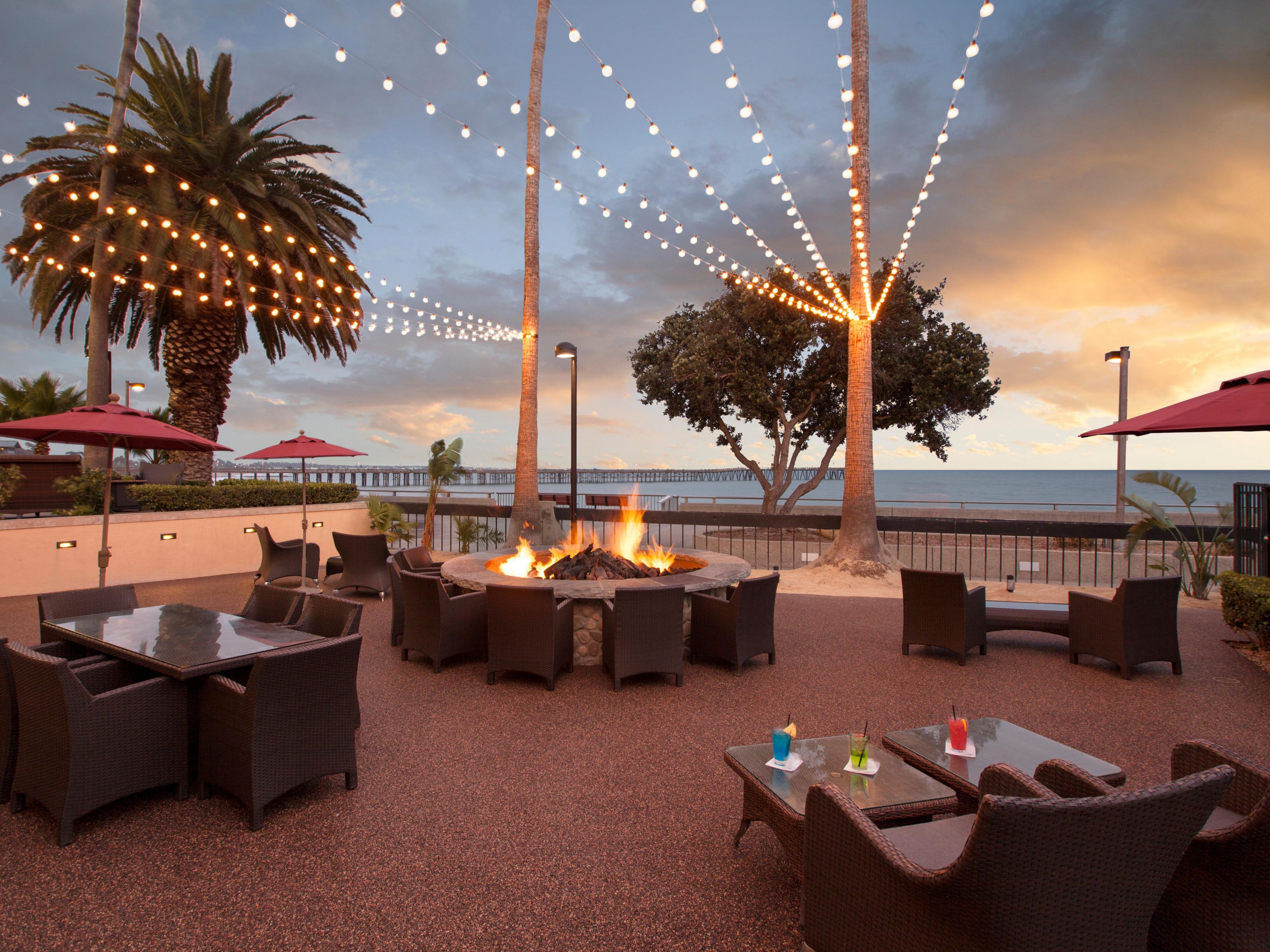 Soak in ocean views from our 2,500 sq. ft. Lanai Patio, perfect for cocktail parties, intimate weddings, and social events. Adjacent to Aqua Beachfront Bar, this breezy outdoor space features a fire pit, ambient lighting, and unforgettable sunsets over the Pacific. Ideal for any gathering!