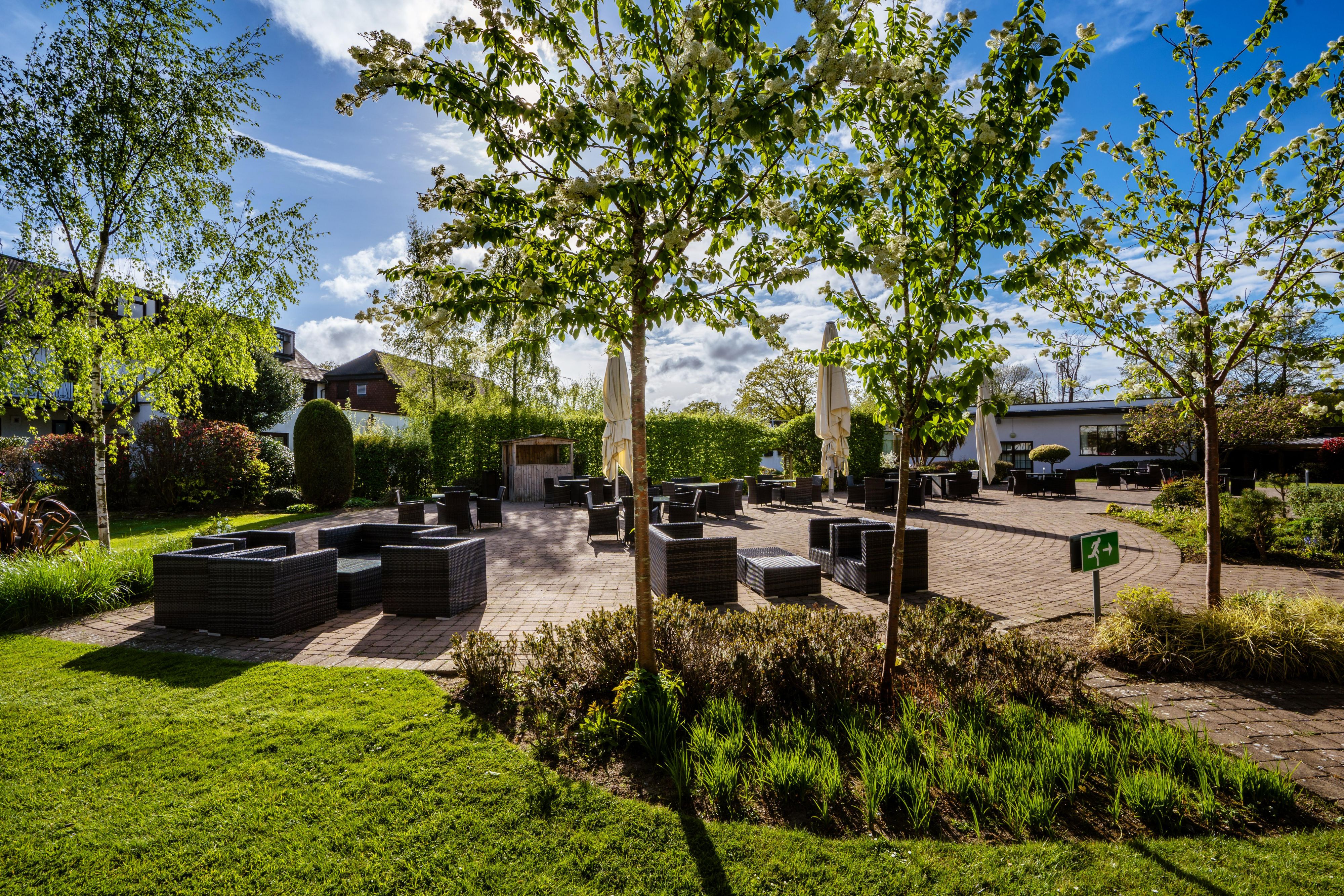 Courtyard garden with al fresco dining area for guests to enjoy.