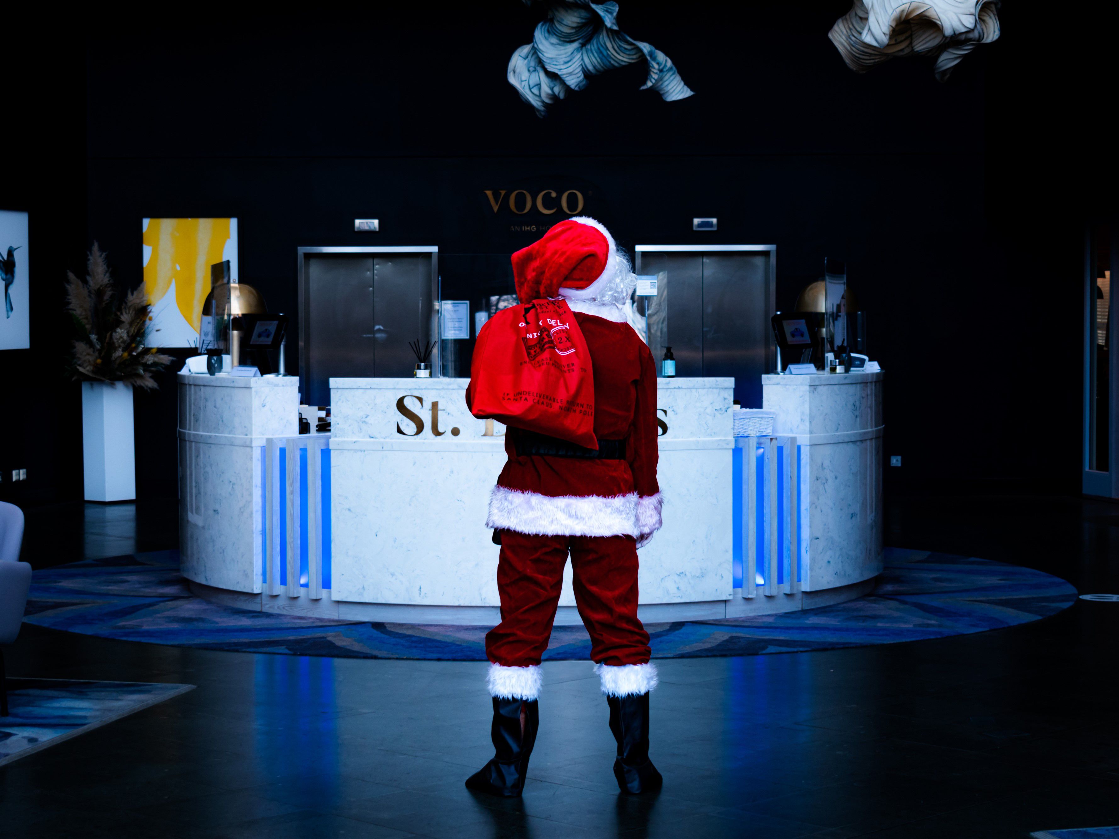 Santa Claus standing in a lobby