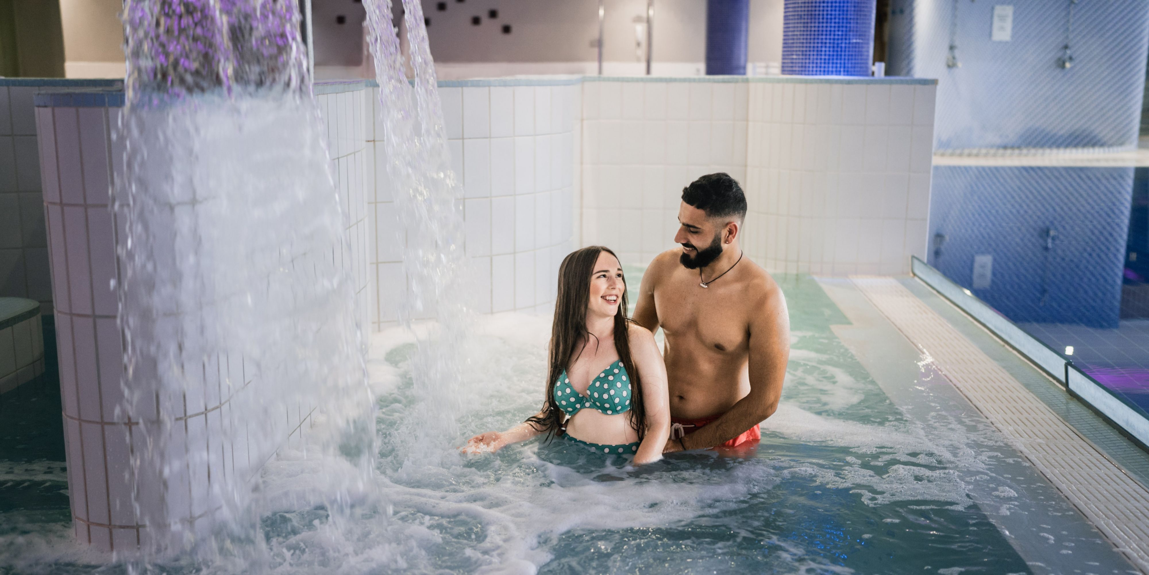 A couple using the spa together