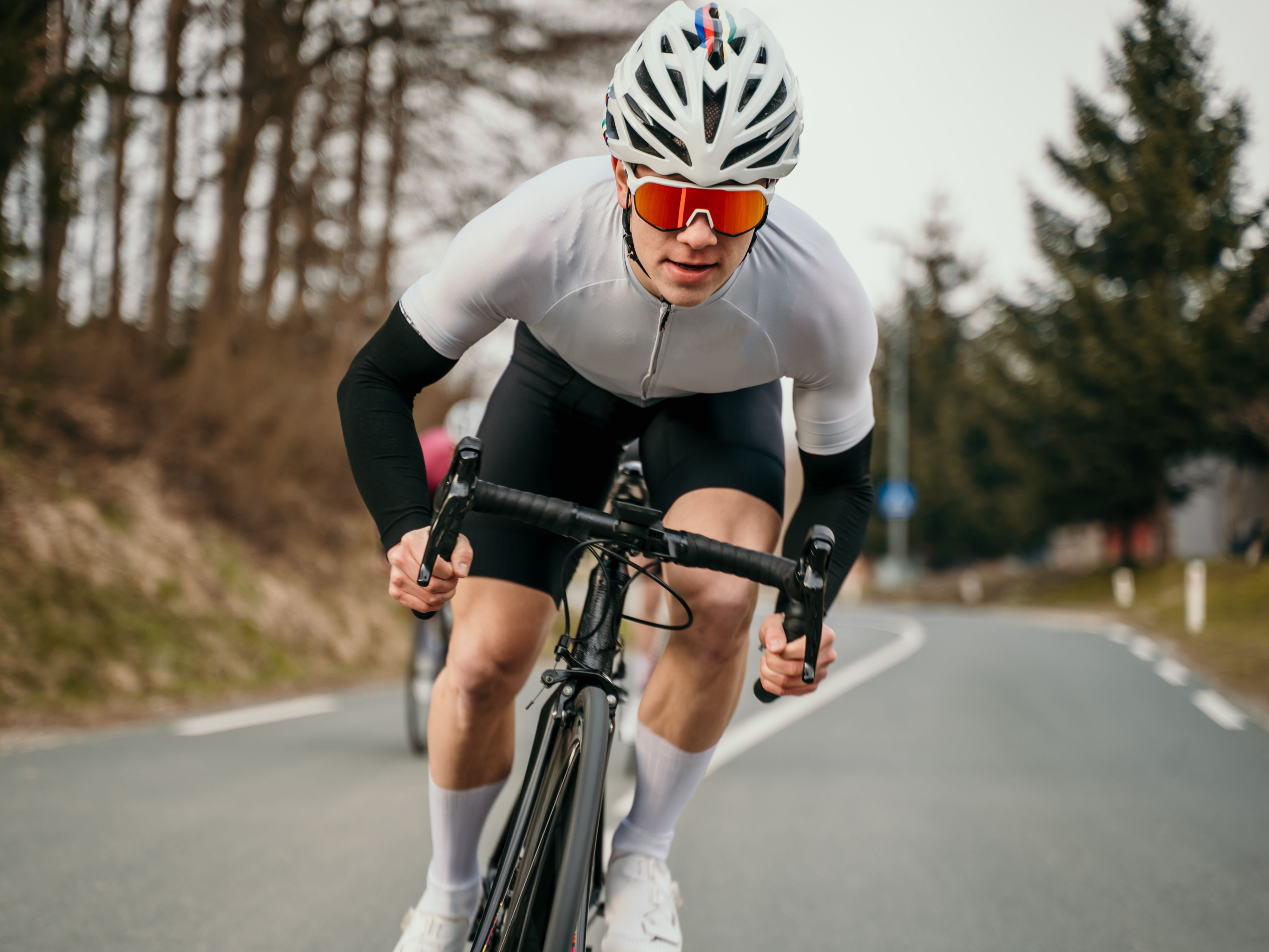 Cyclist riding on a road in full gear
