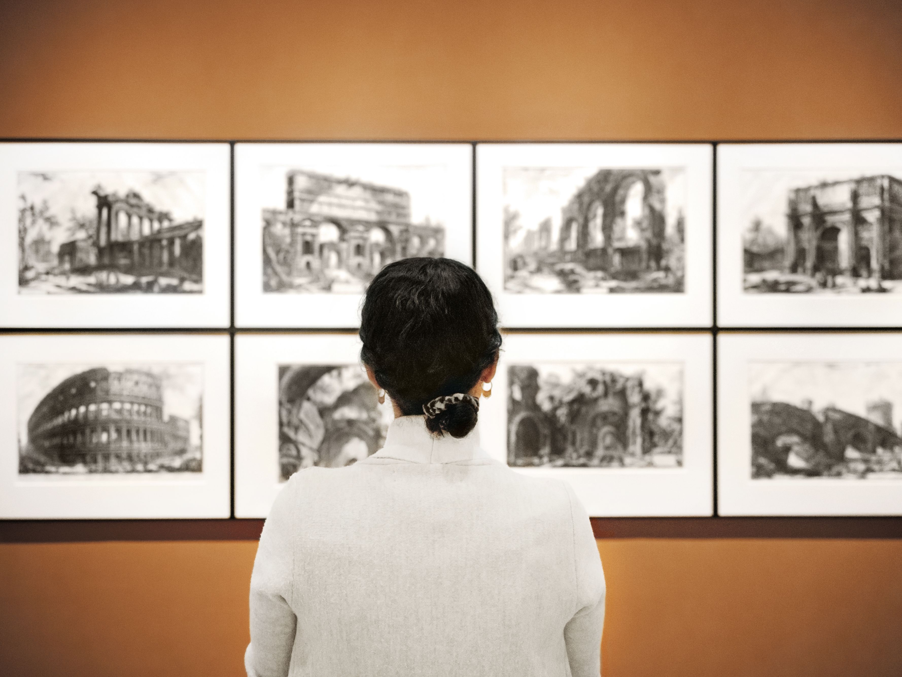 woman standing in front of museum display