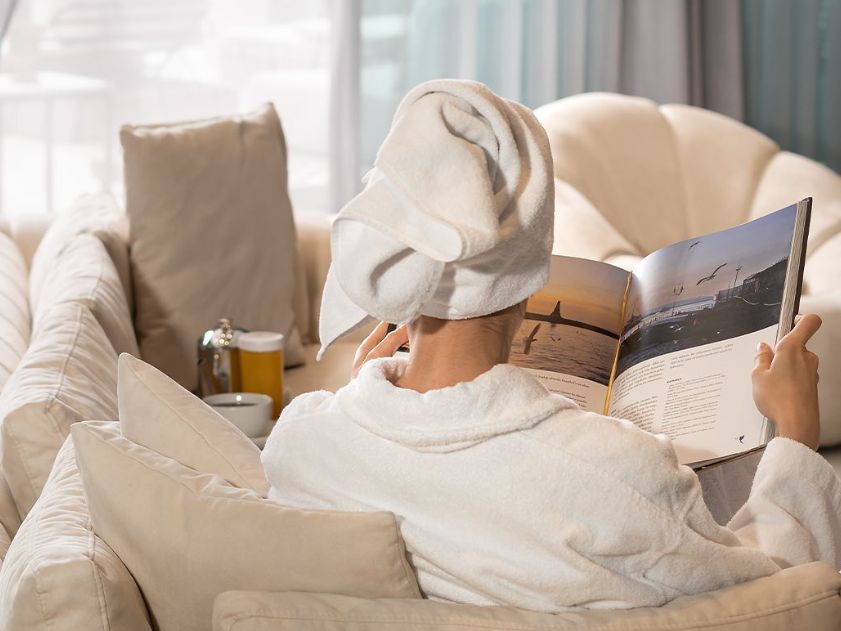 Woman relaxing in her hotel room