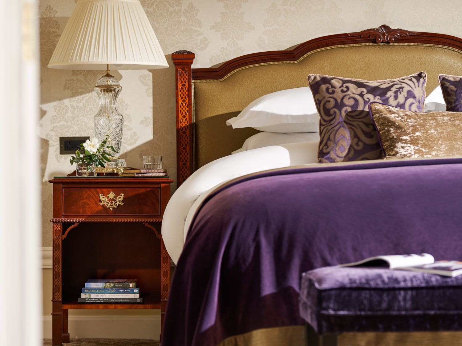 king sized bed with purple comforter