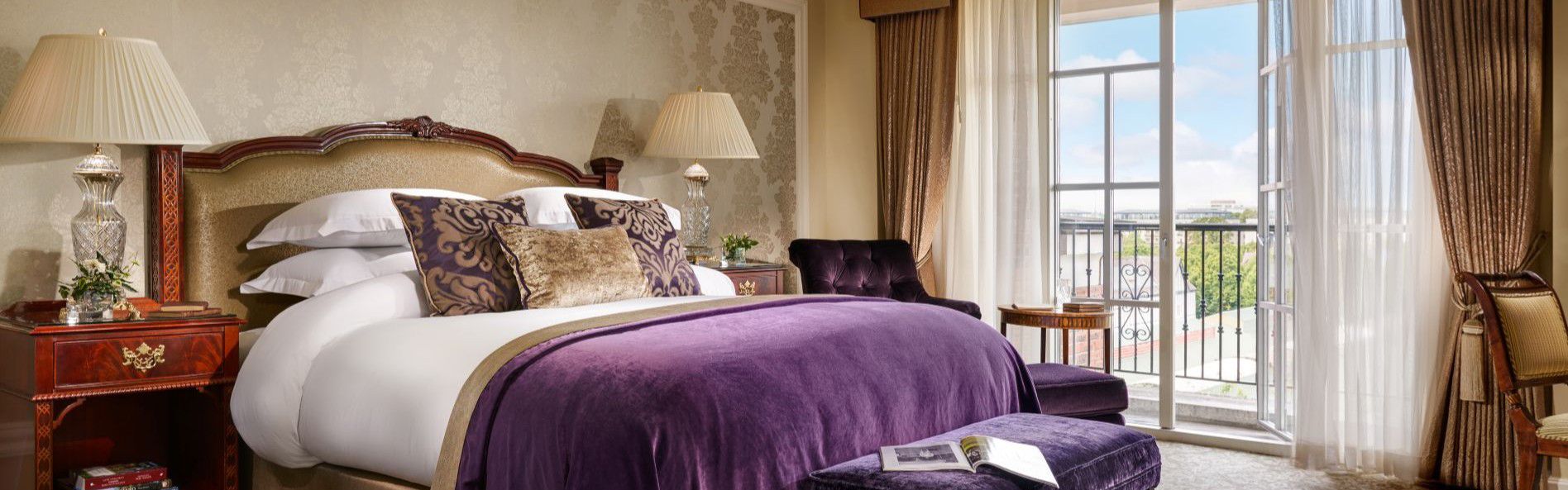 lady gregory suite with king-sized bed  and purple decor