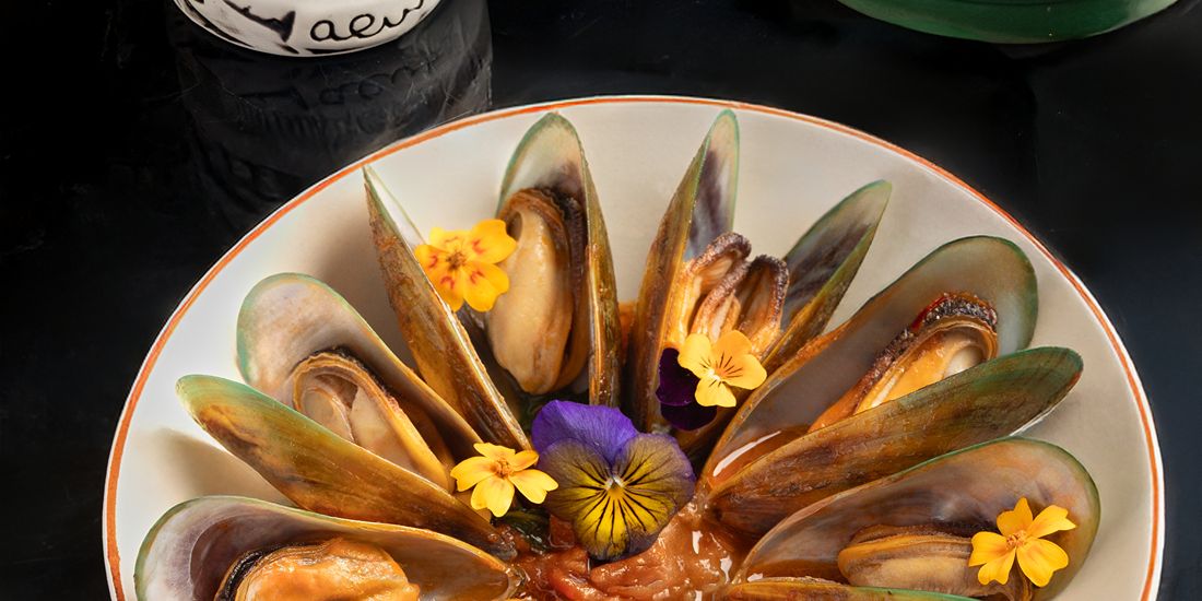 Fresh mussels beautifully presented with vibrant flavors and refined coastal elegance.