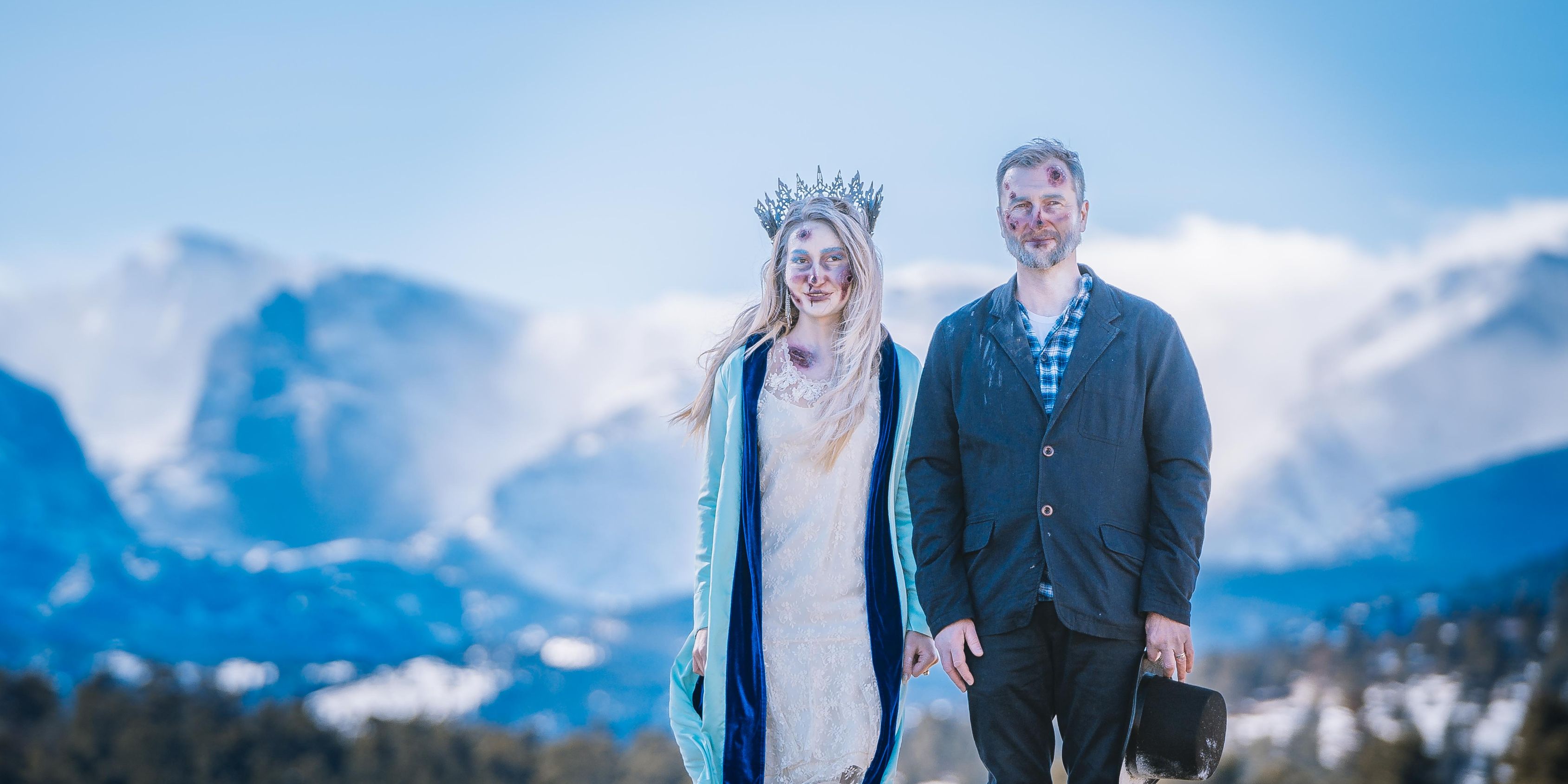 A couple dressed up like zombies