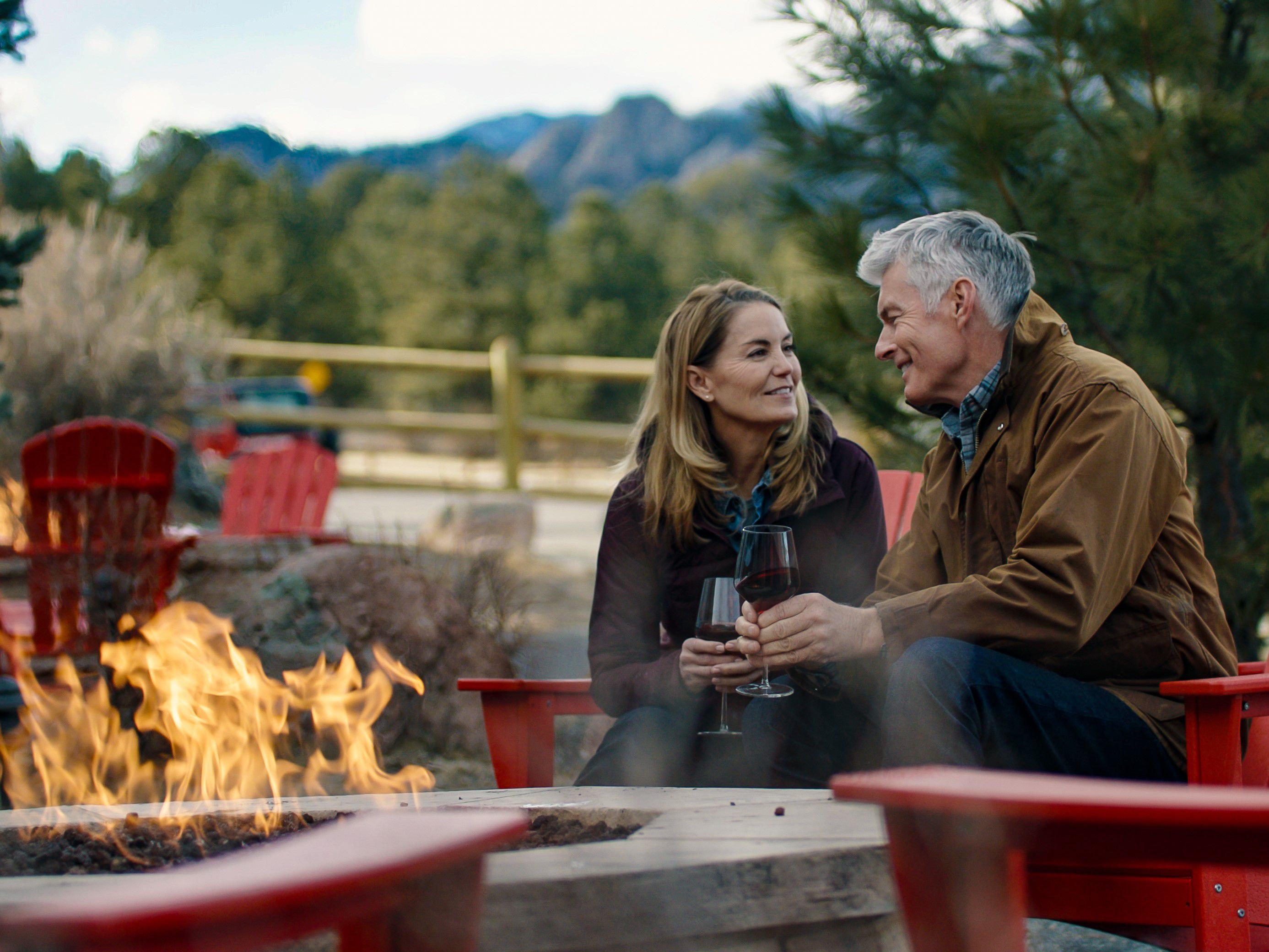 Enjoying a glass of wine by the firepits