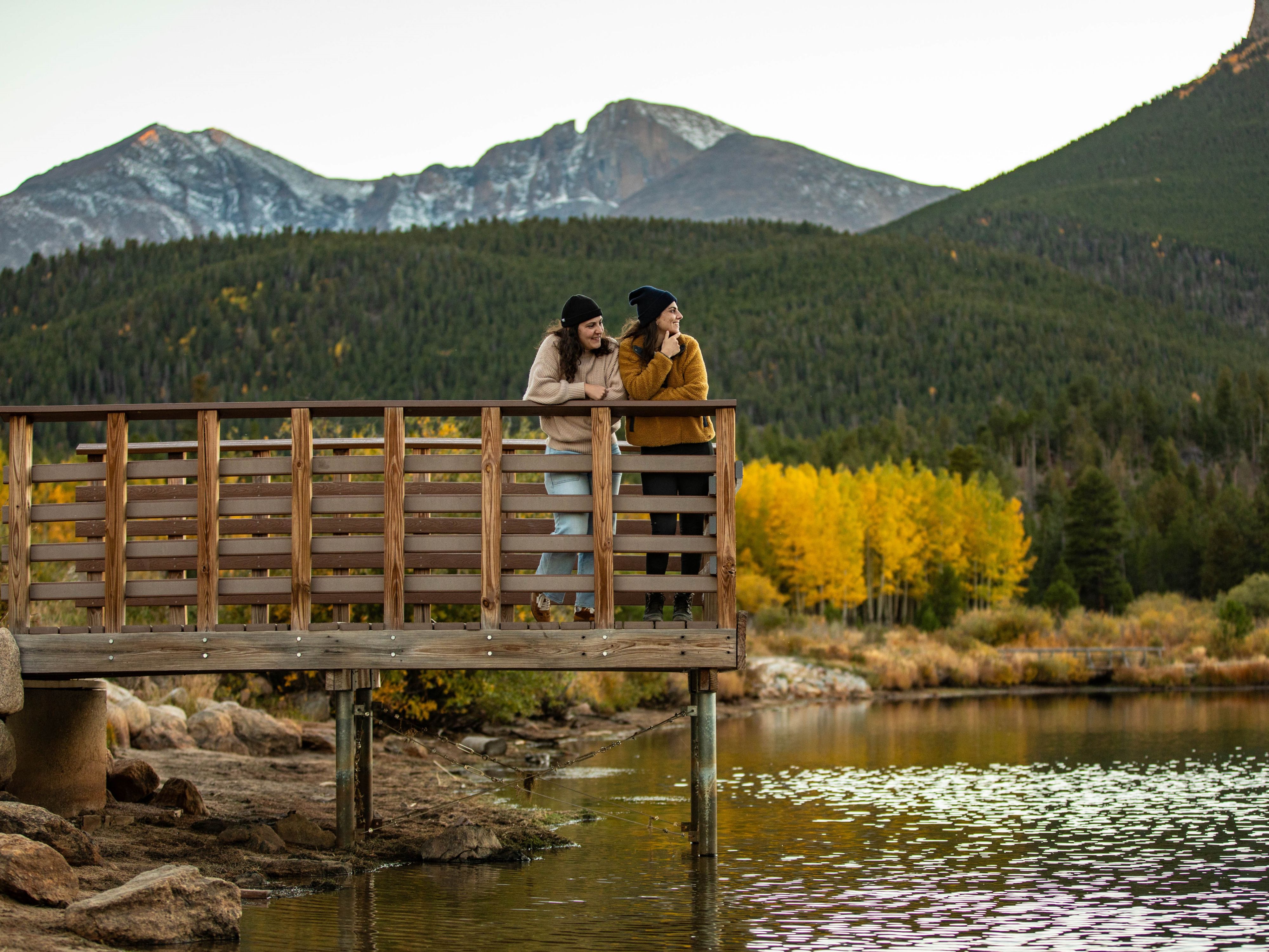 Friends on a dock looking at the scenery