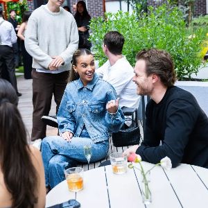 Lively outdoor gathering with friends and garden seating
