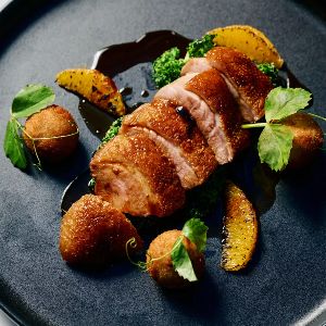 Gourmet roasted duck with vegetables and rich sauce