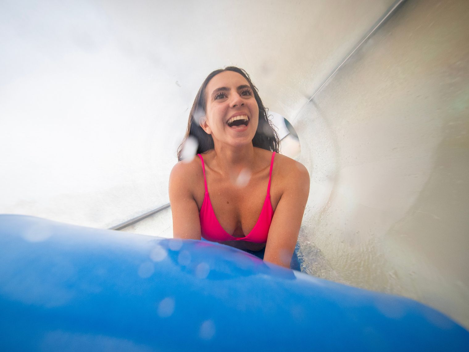 Sliding down water slide 