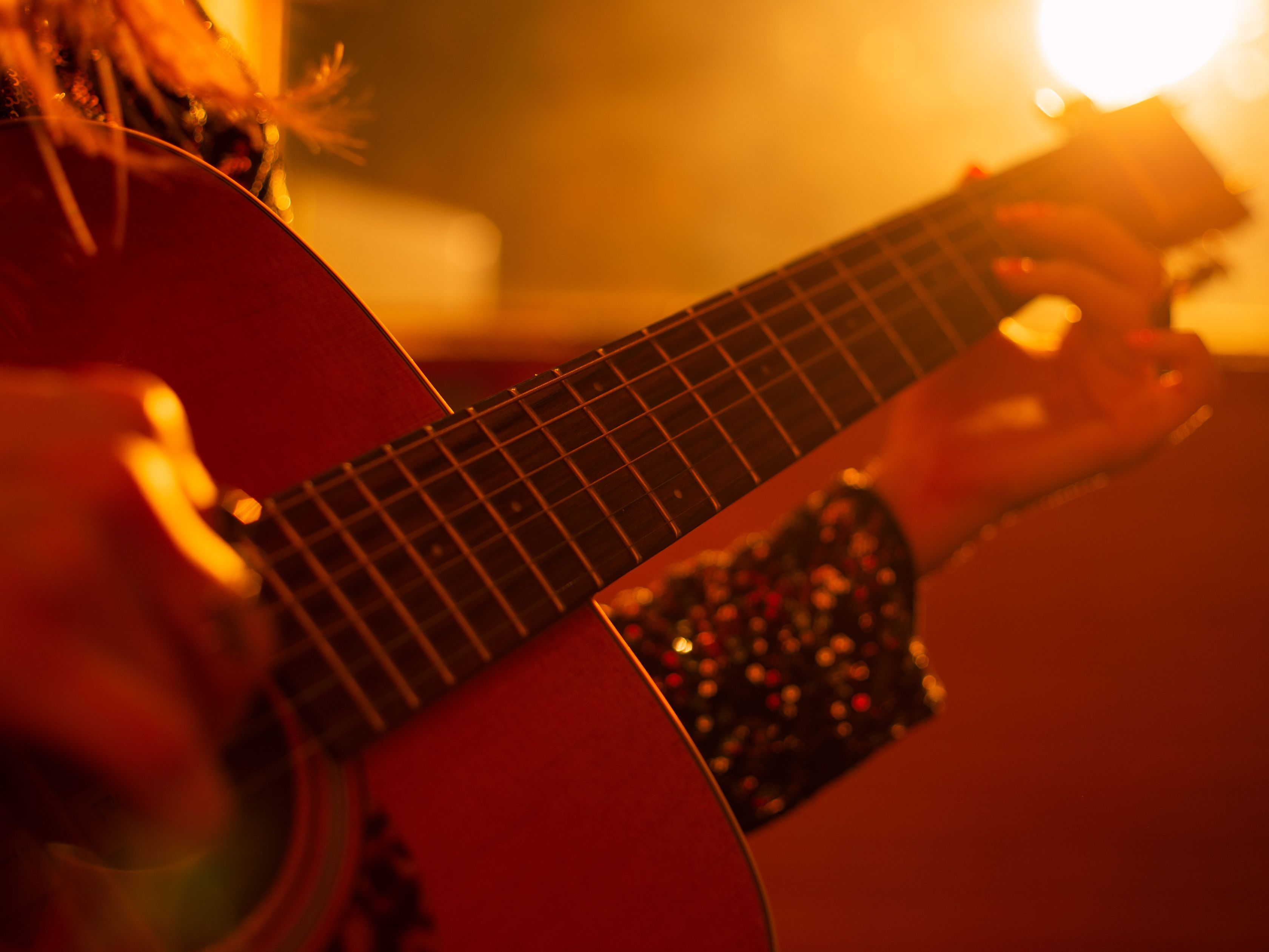Woman playing an acoustic guitar