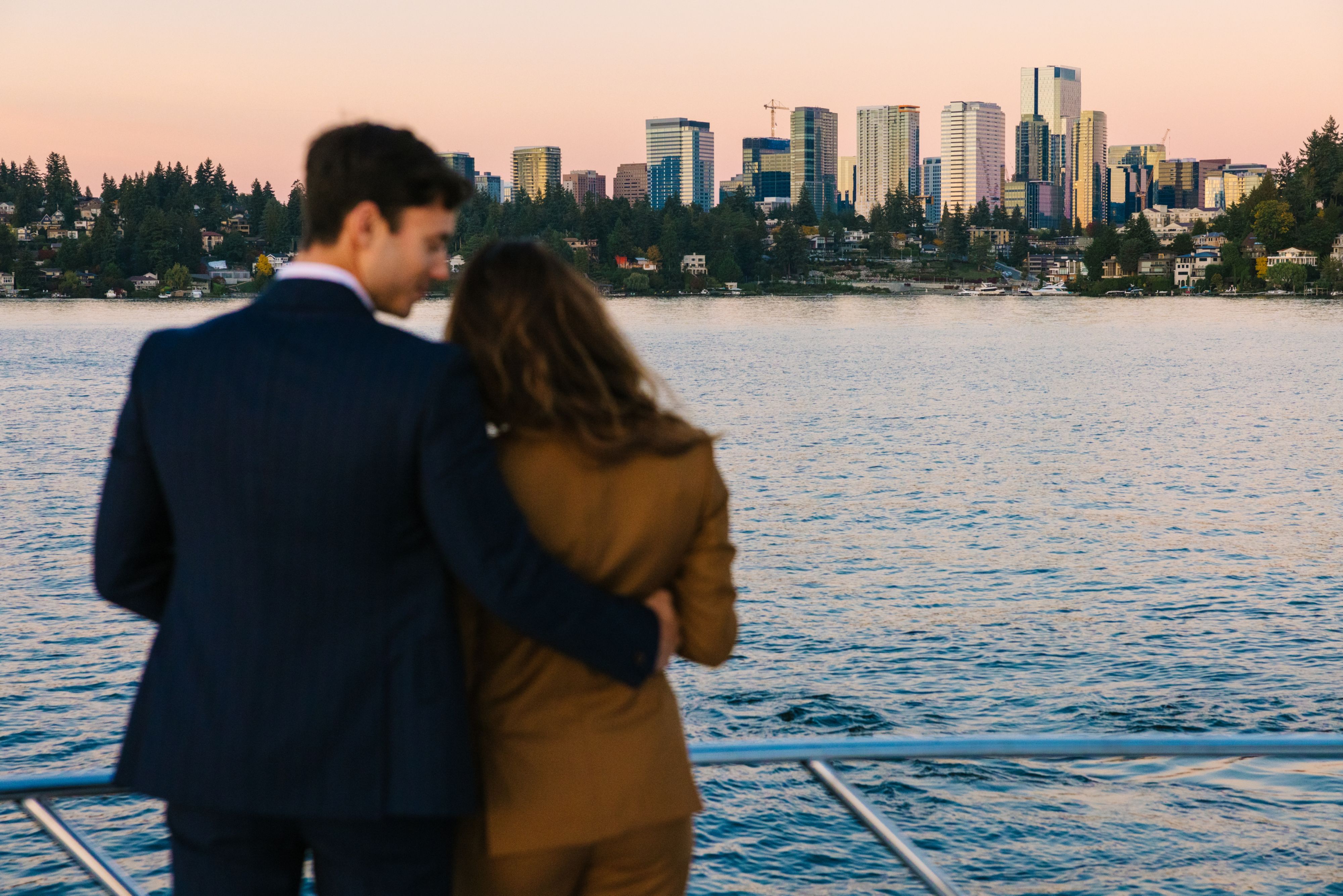 Couple on boat looking at Seattle skyline