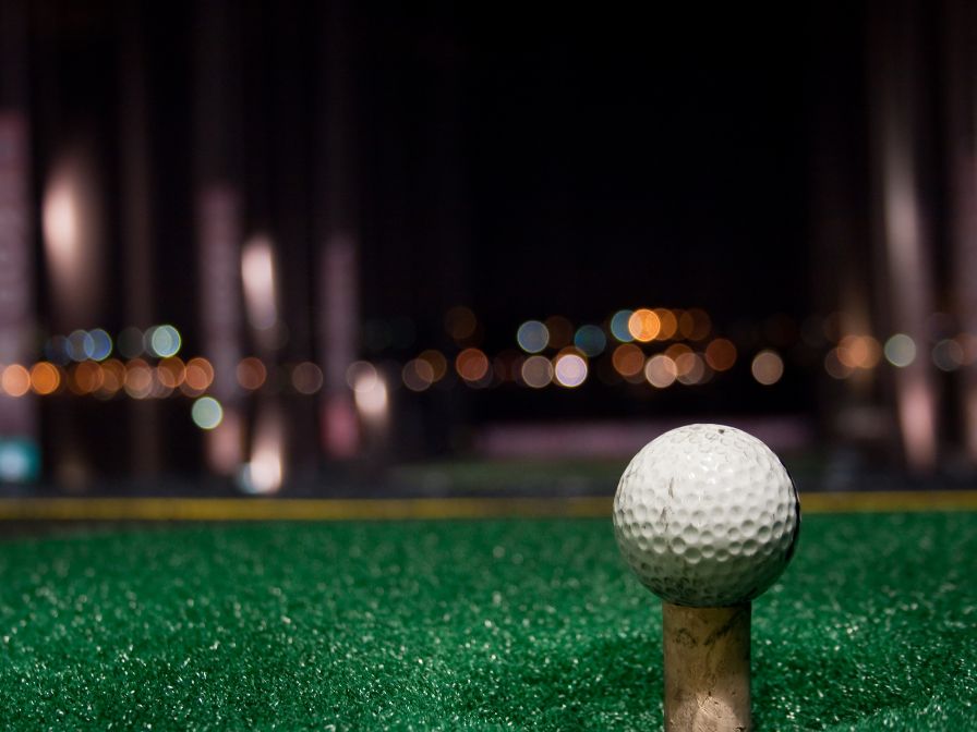 Driving range and golf ball on golf tee