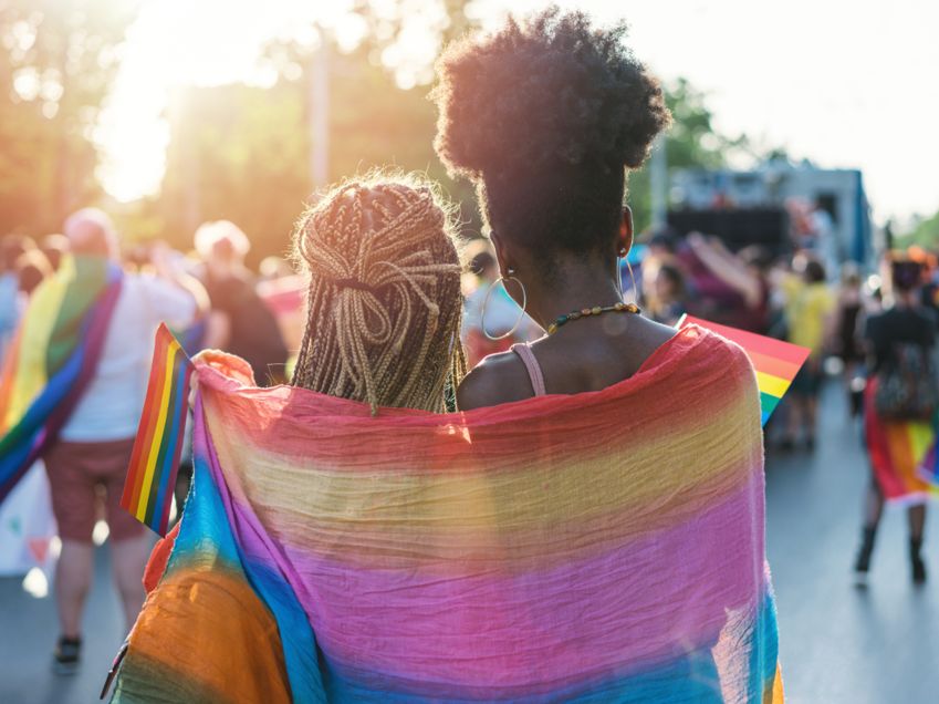 people with pride flag at festival