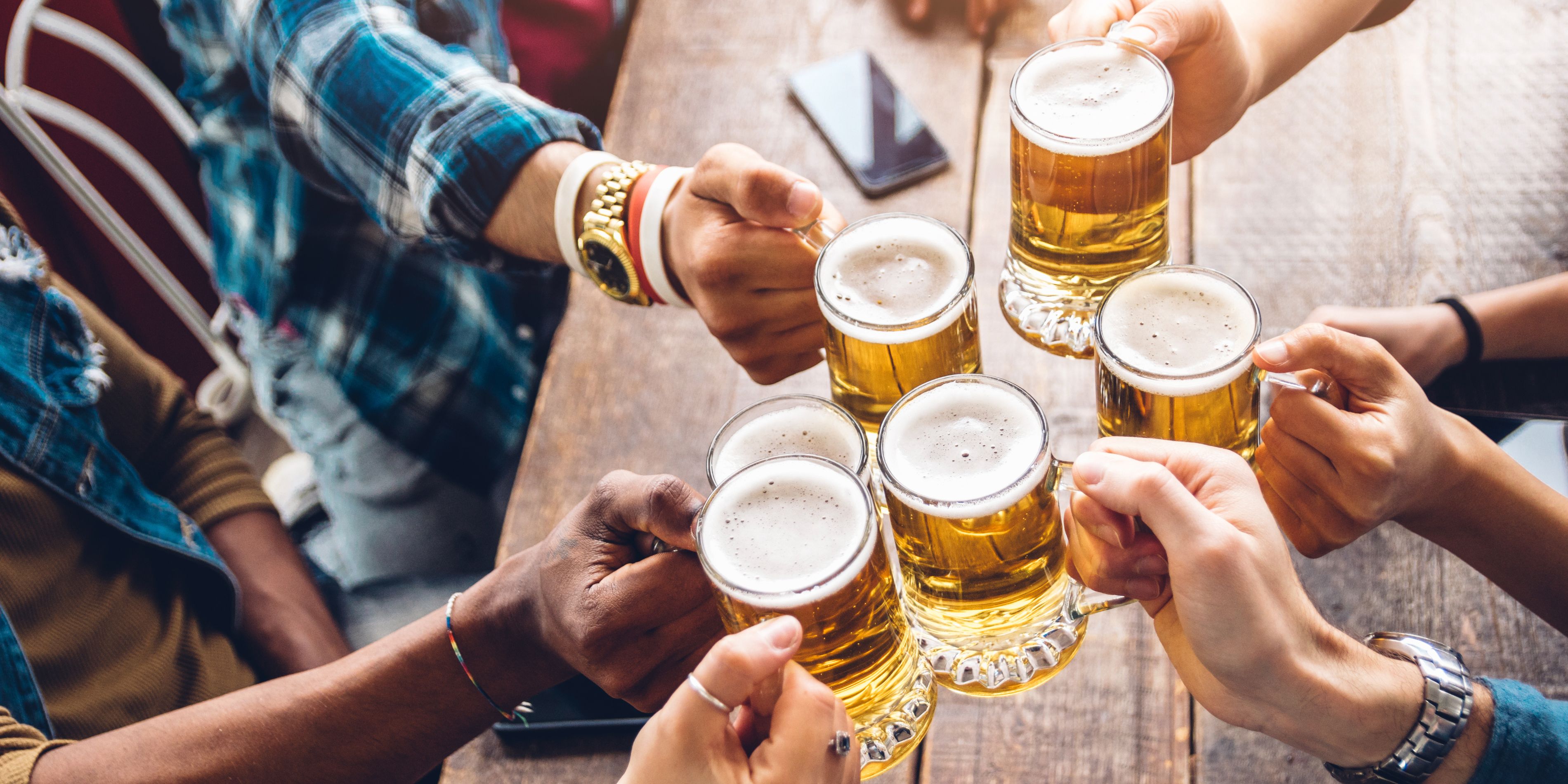 Group cheersing with beers