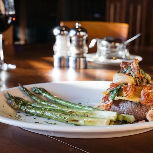 Steak and asparagus dinner with wine