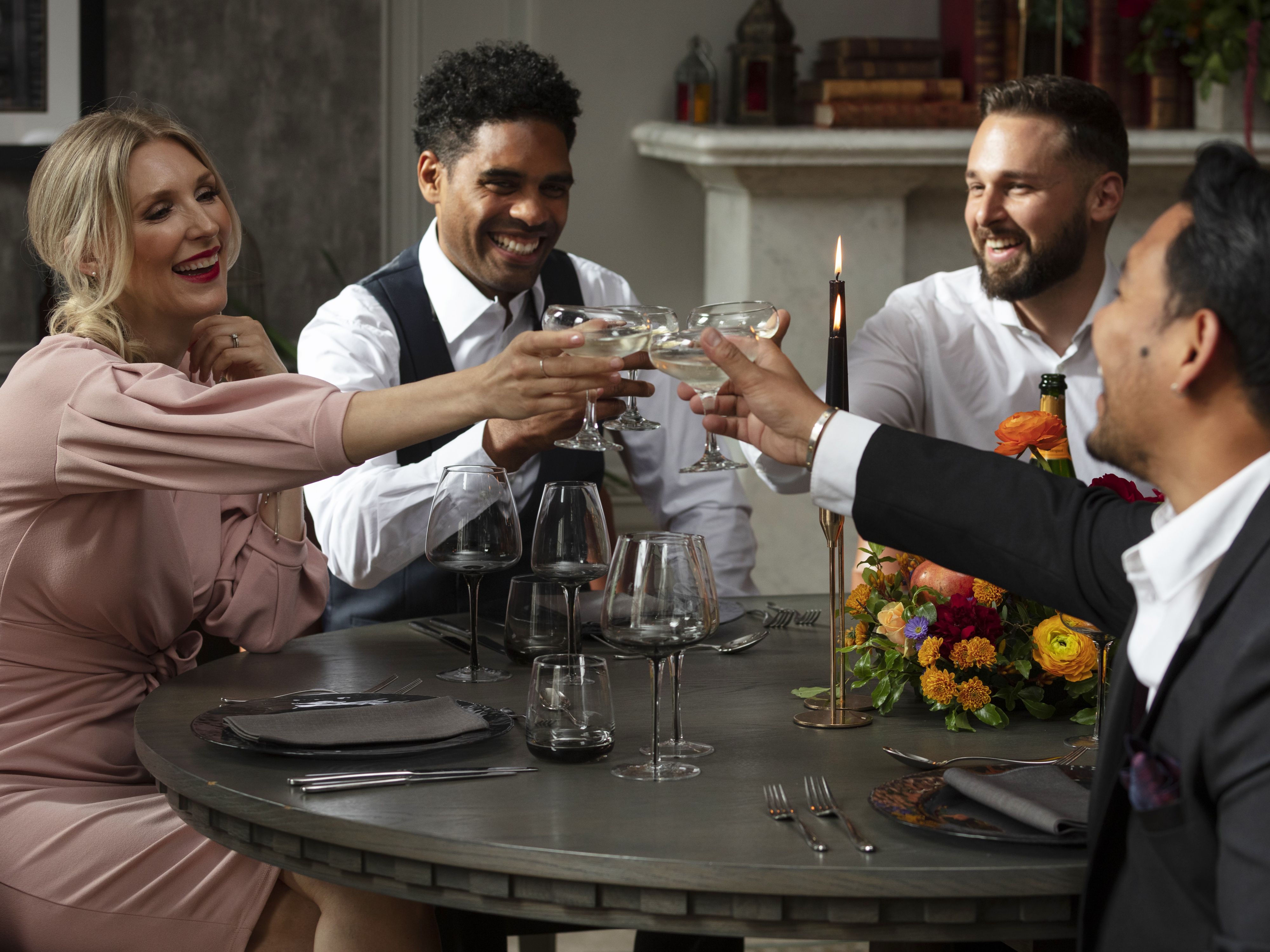 Friends sharing a drink in fine clothing
