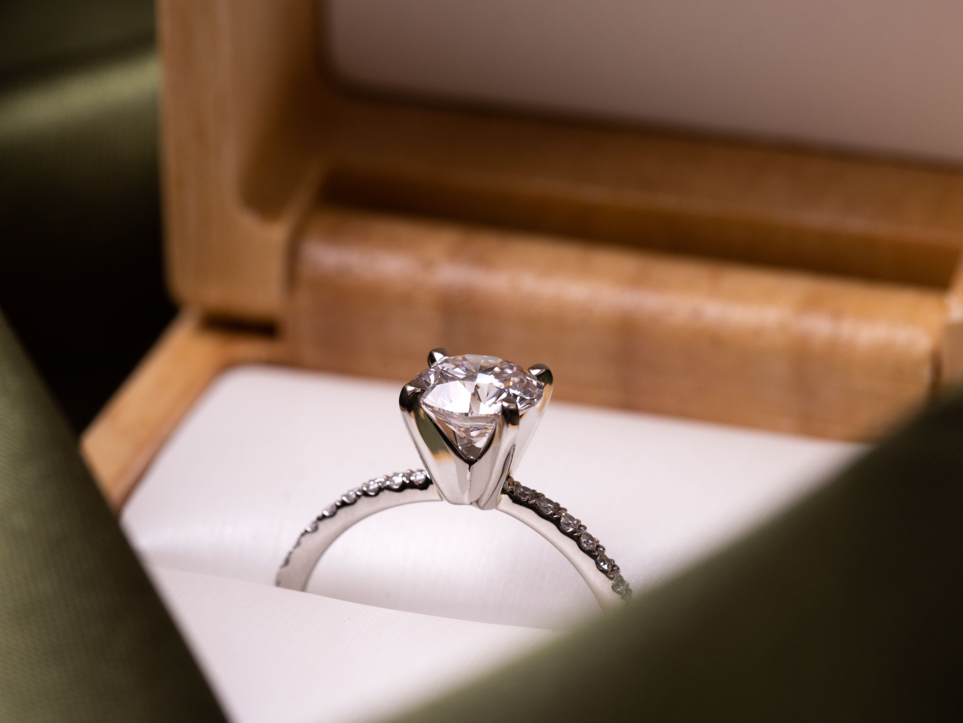 Engagement ring in a ring box.