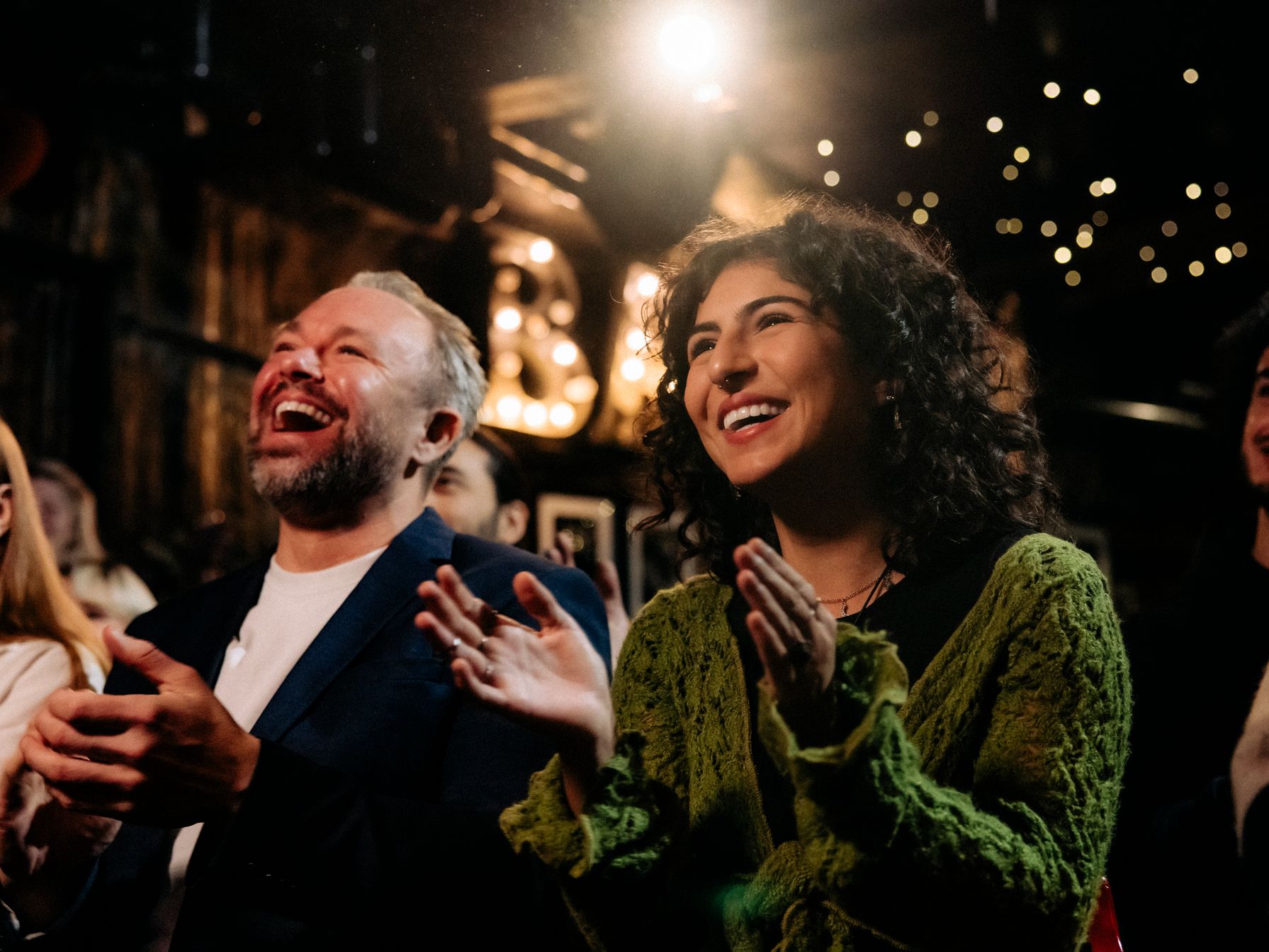 Audience clapping at a performance