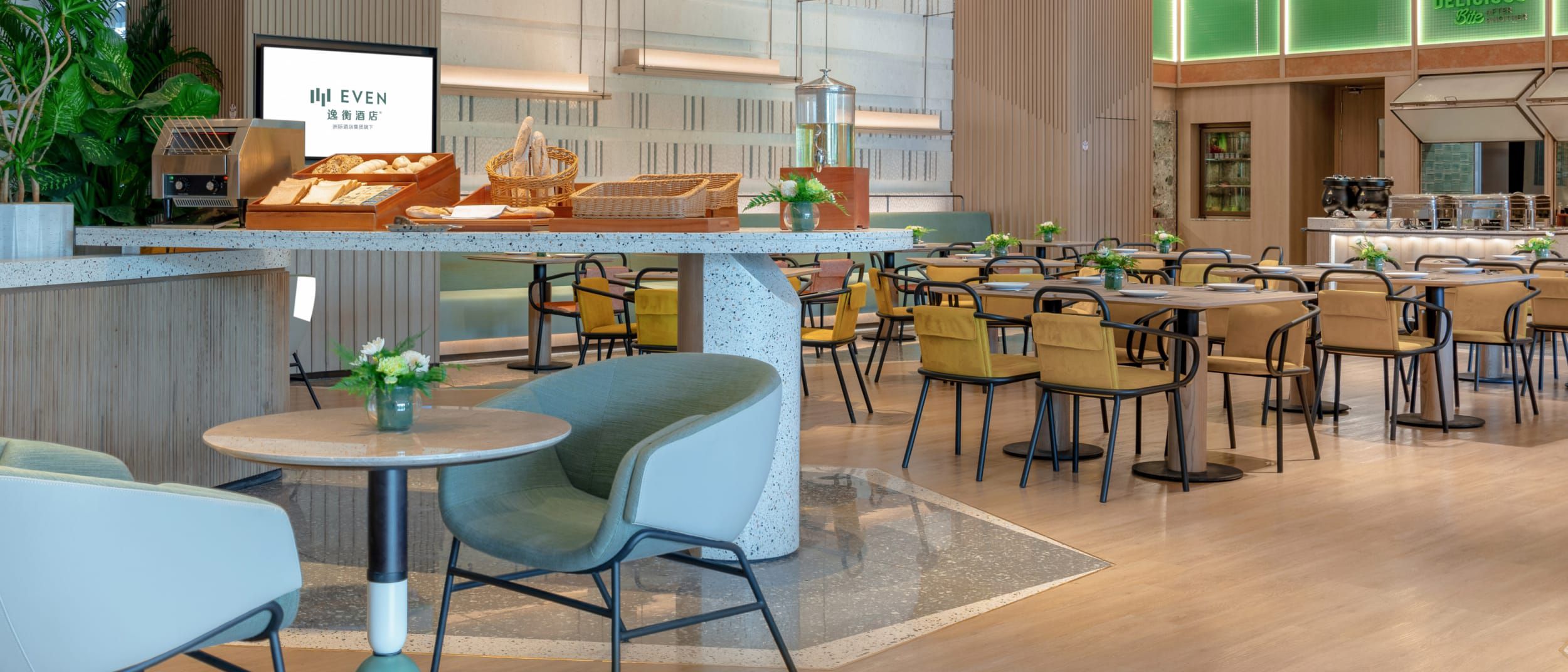 A modern restaurant with plenty of seating and space.